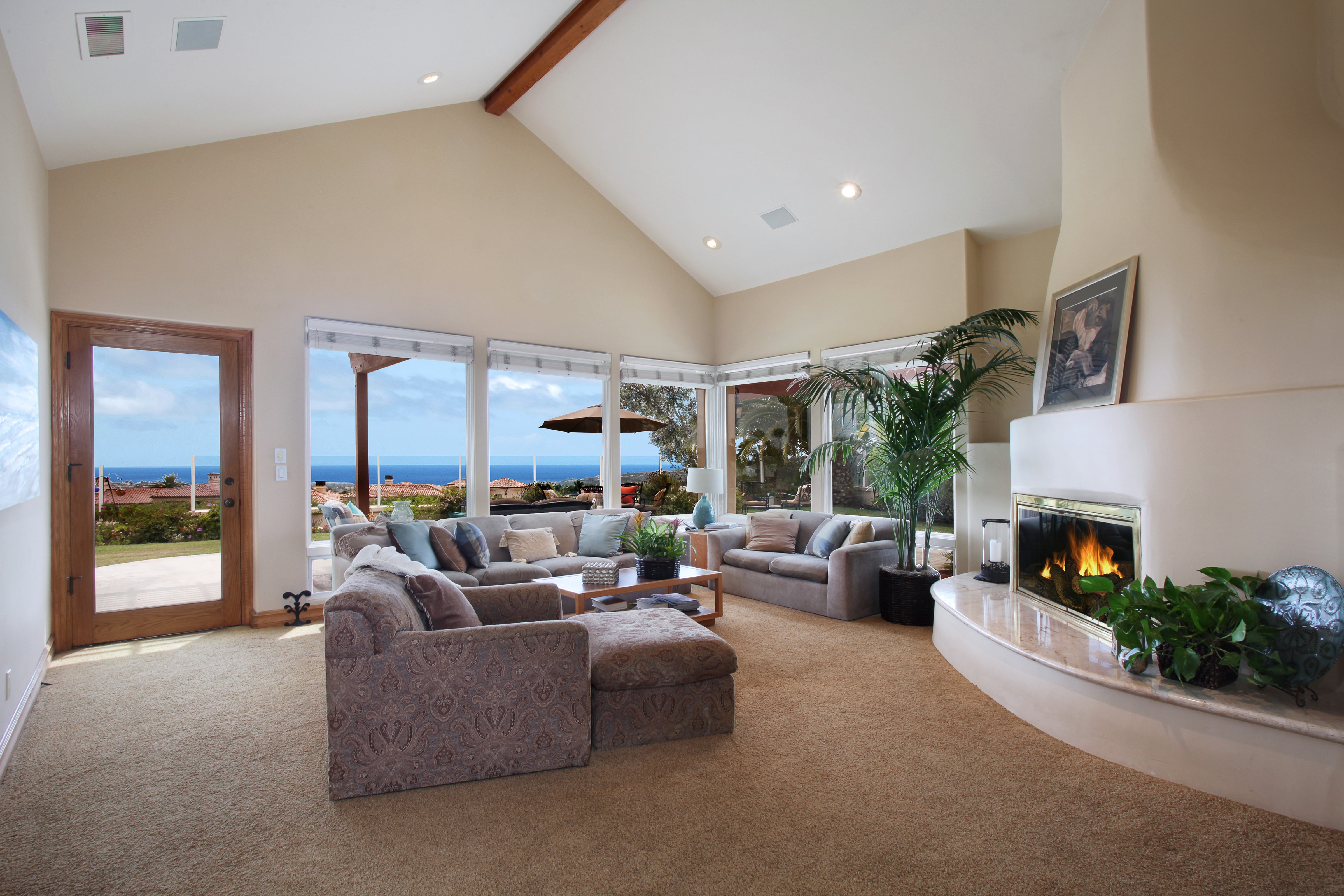 Living room with fireplace and ocean view HD Wallpaper