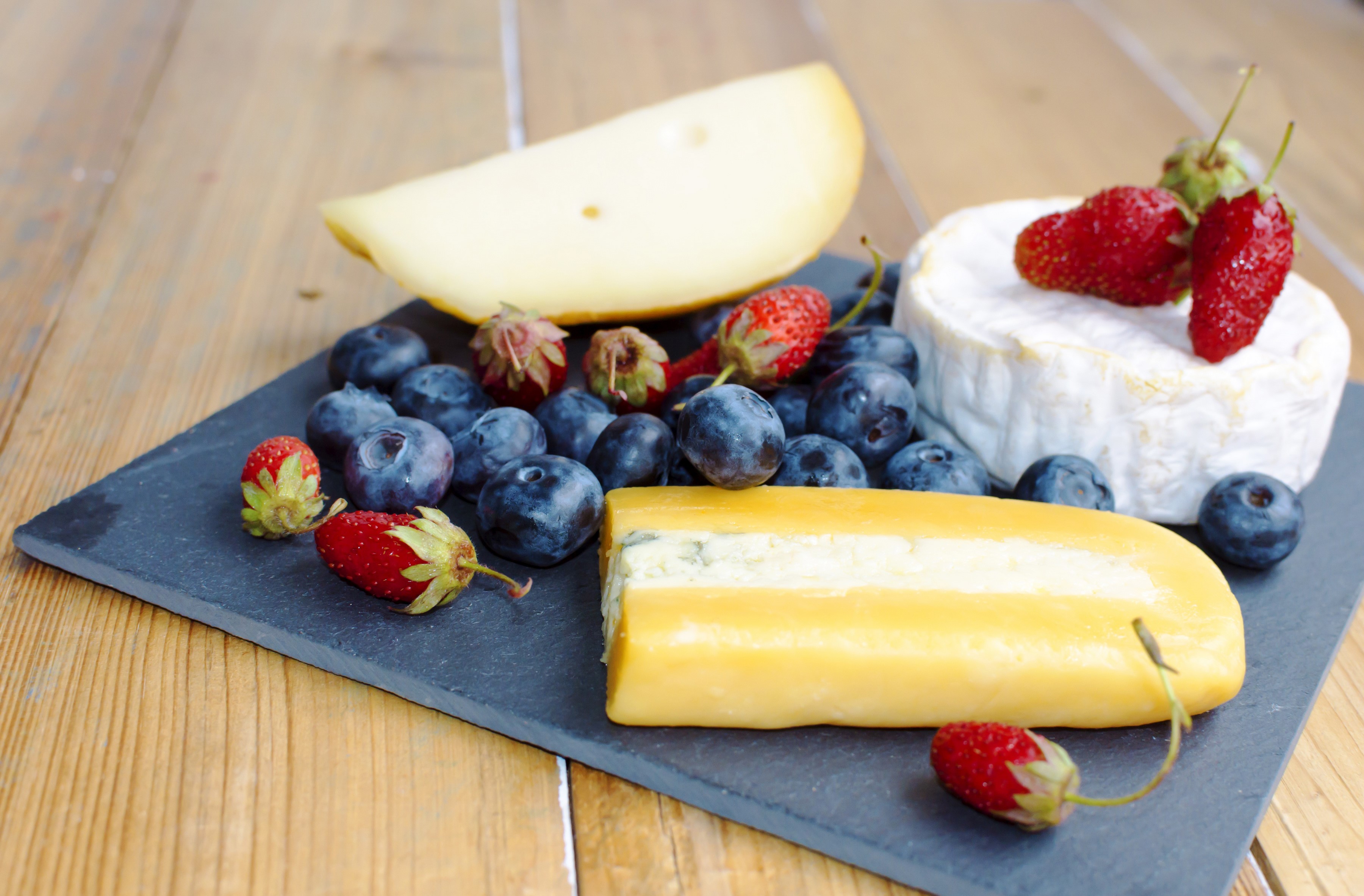 Cheese platter with blueberries and strawberries HD Wallpaper