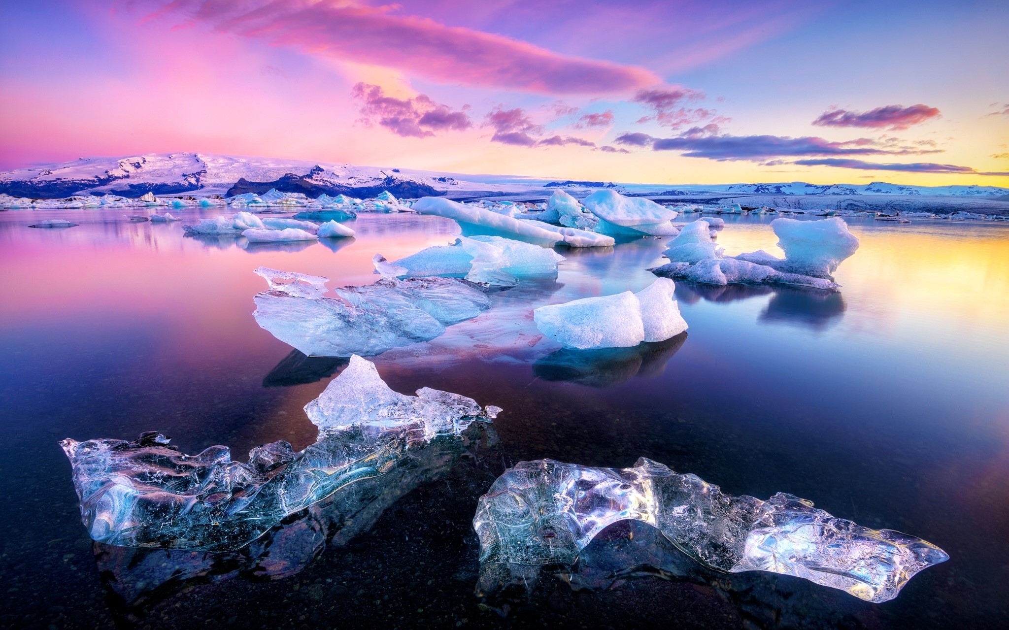 Icebergs floating in a lake at sunset HD Wallpaper