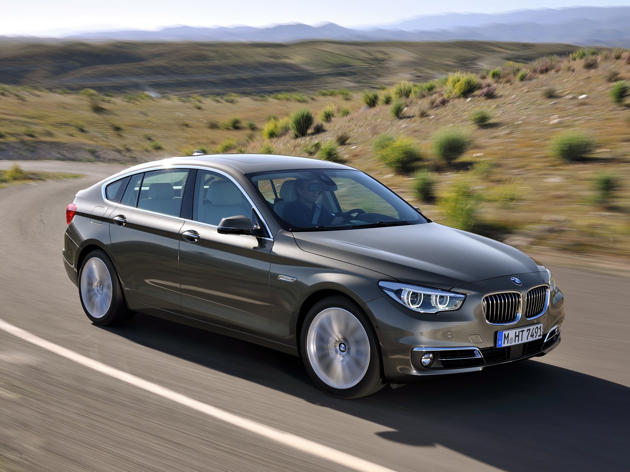 BMW 535i xDrive Gran Turismo Luxury Line driving on road HD Wallpaper