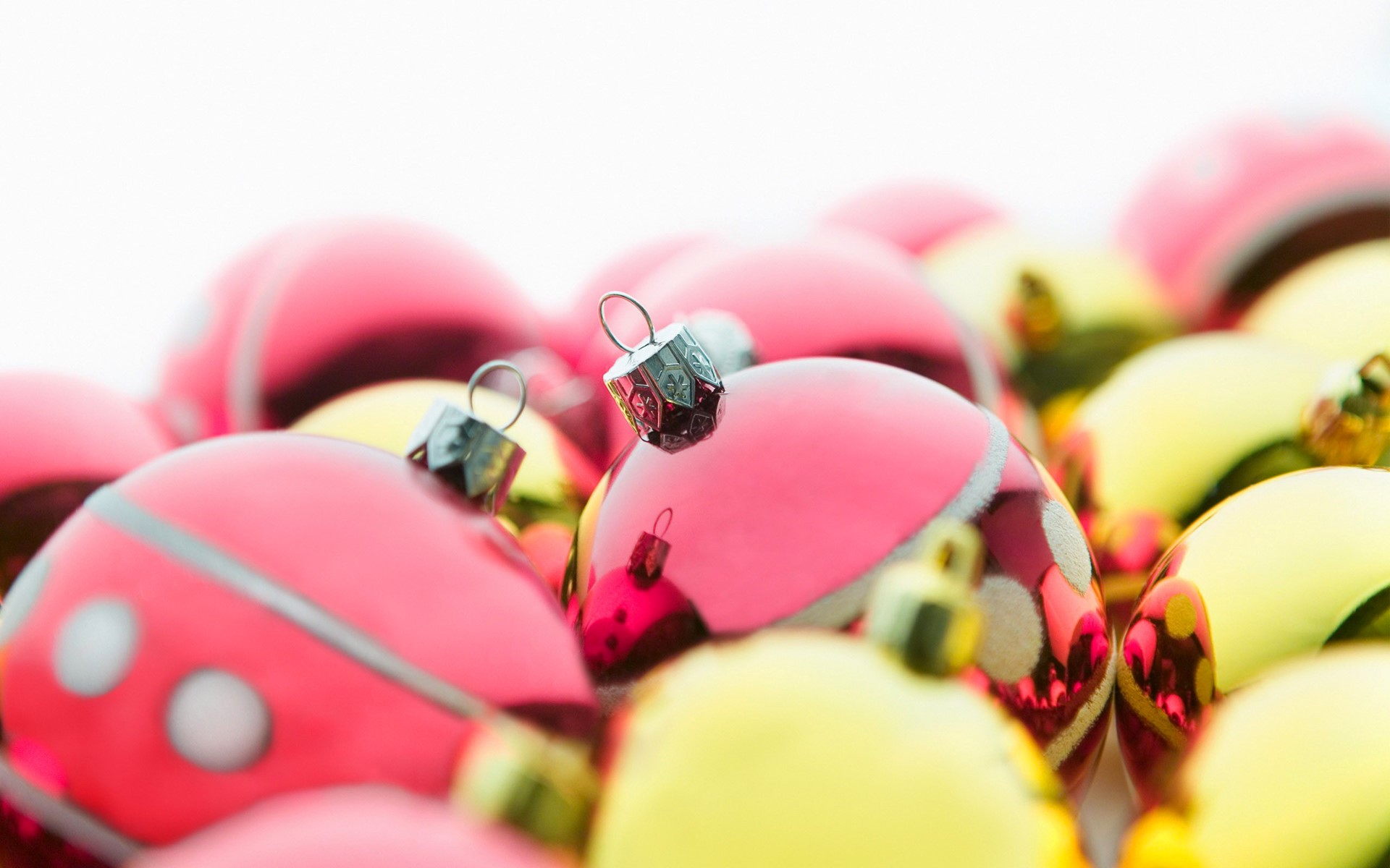 Close-up of Pink and Yellow Christmas Ornaments HD Wallpaper