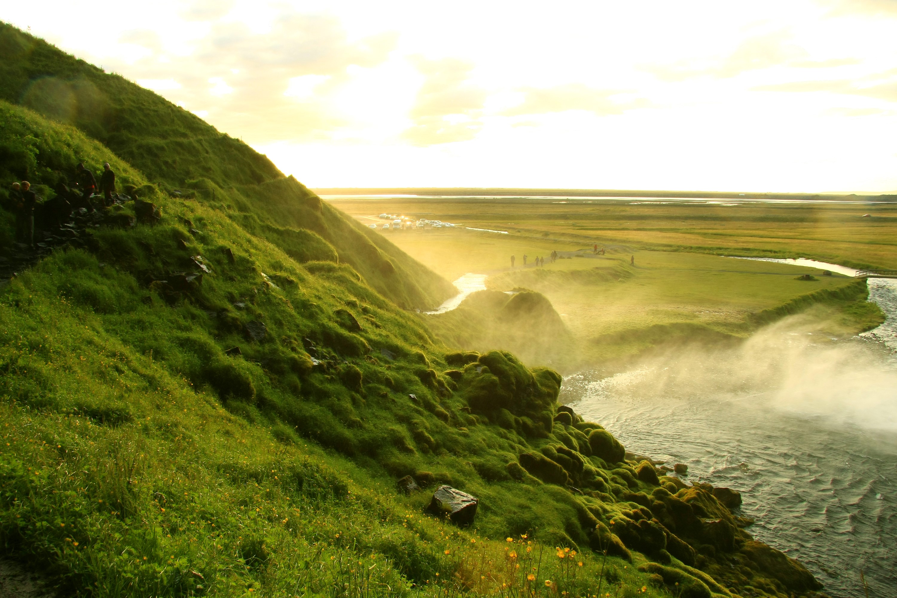 Seljalandsfoss waterfall in Iceland with green hills HD Wallpaper