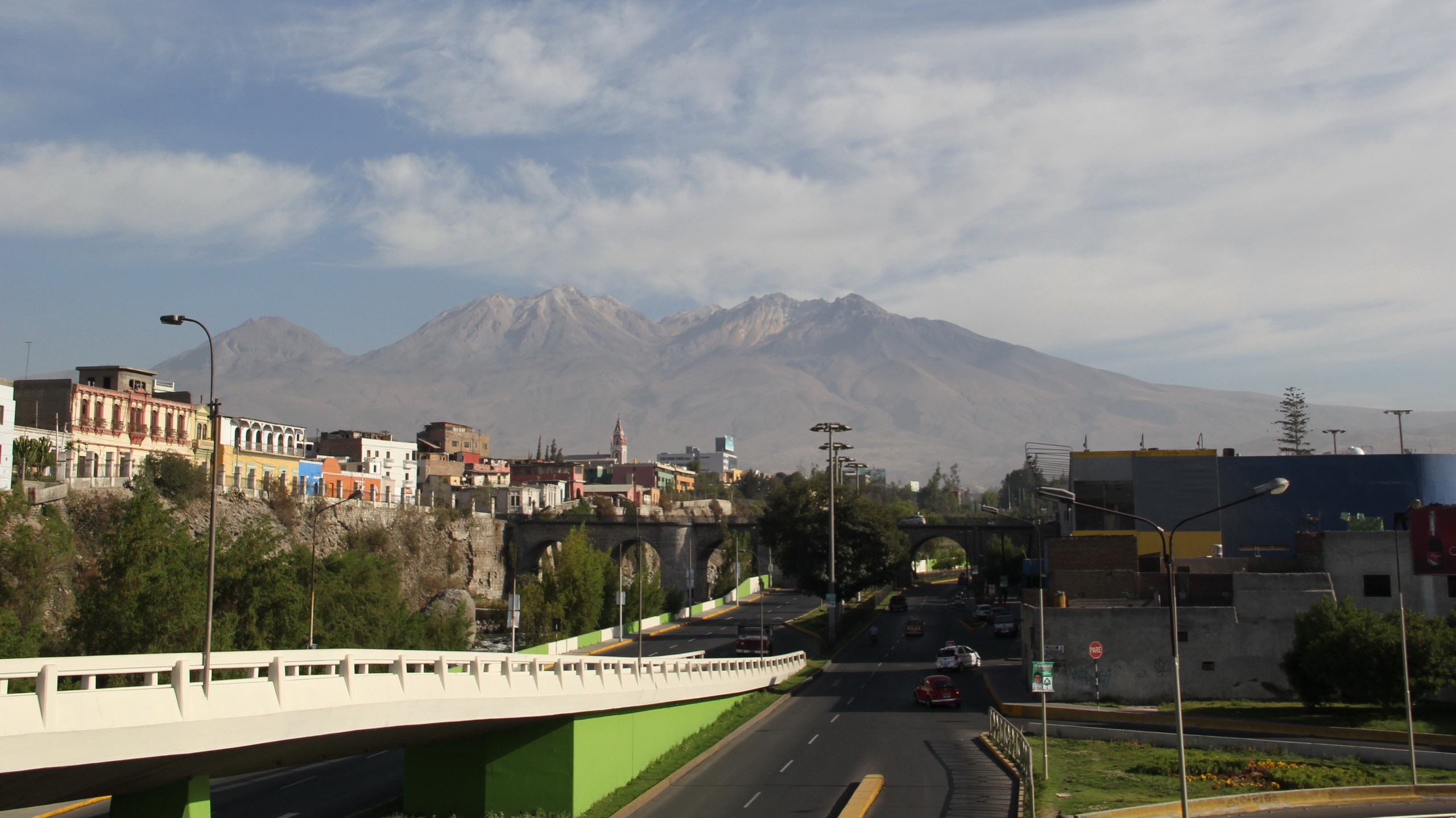 Cityscape with Mountains and Bridges HD Wallpaper