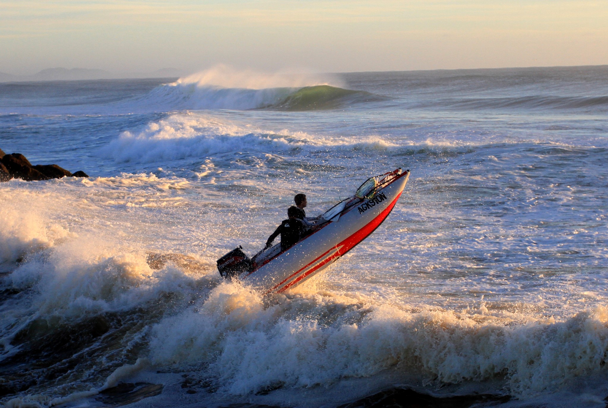 Motorboat navigating rough waves at sea HD Wallpaper
