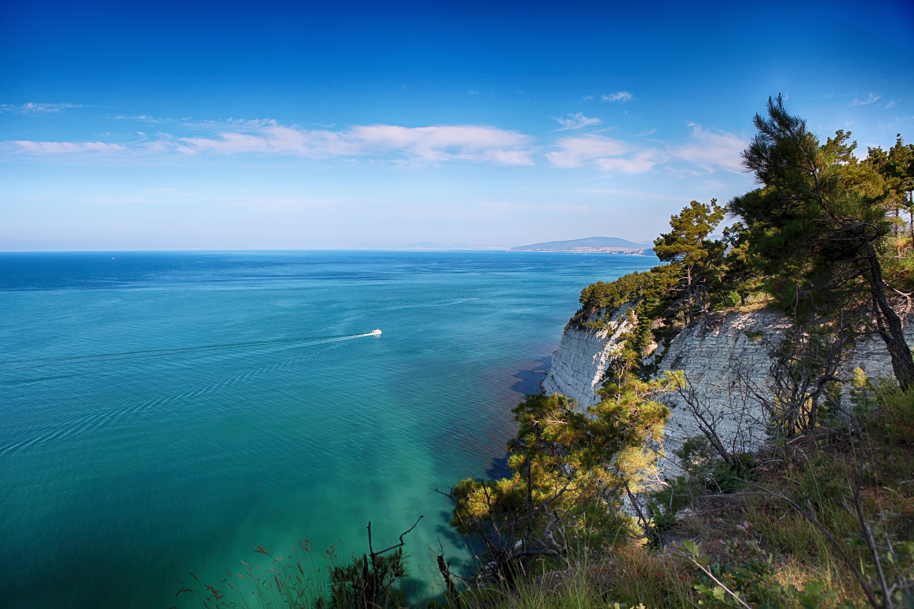 Sea and Sky over a Rocky Coastline HD Wallpaper