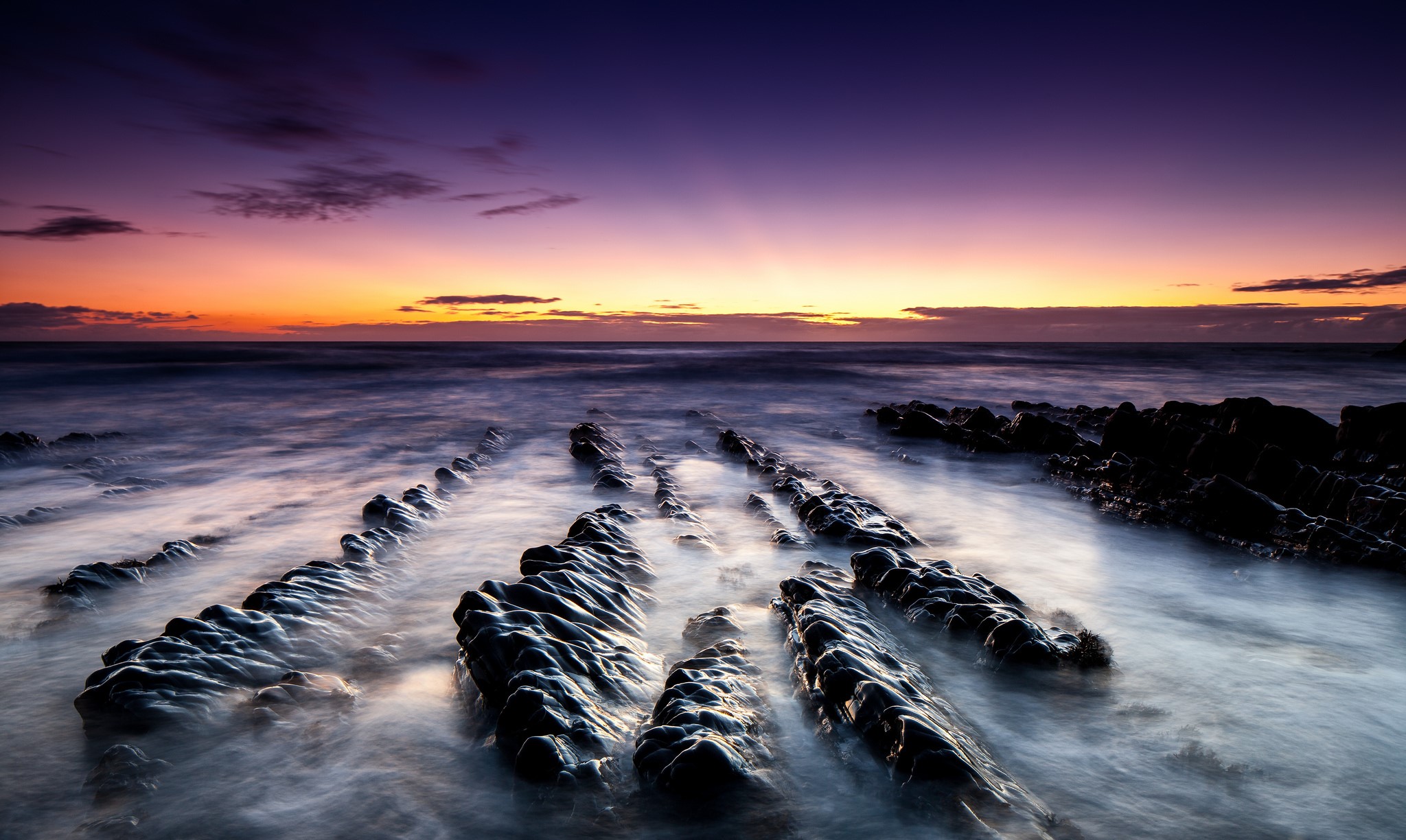 Sea and Sunset Over Rocky Shoreline HD Wallpaper