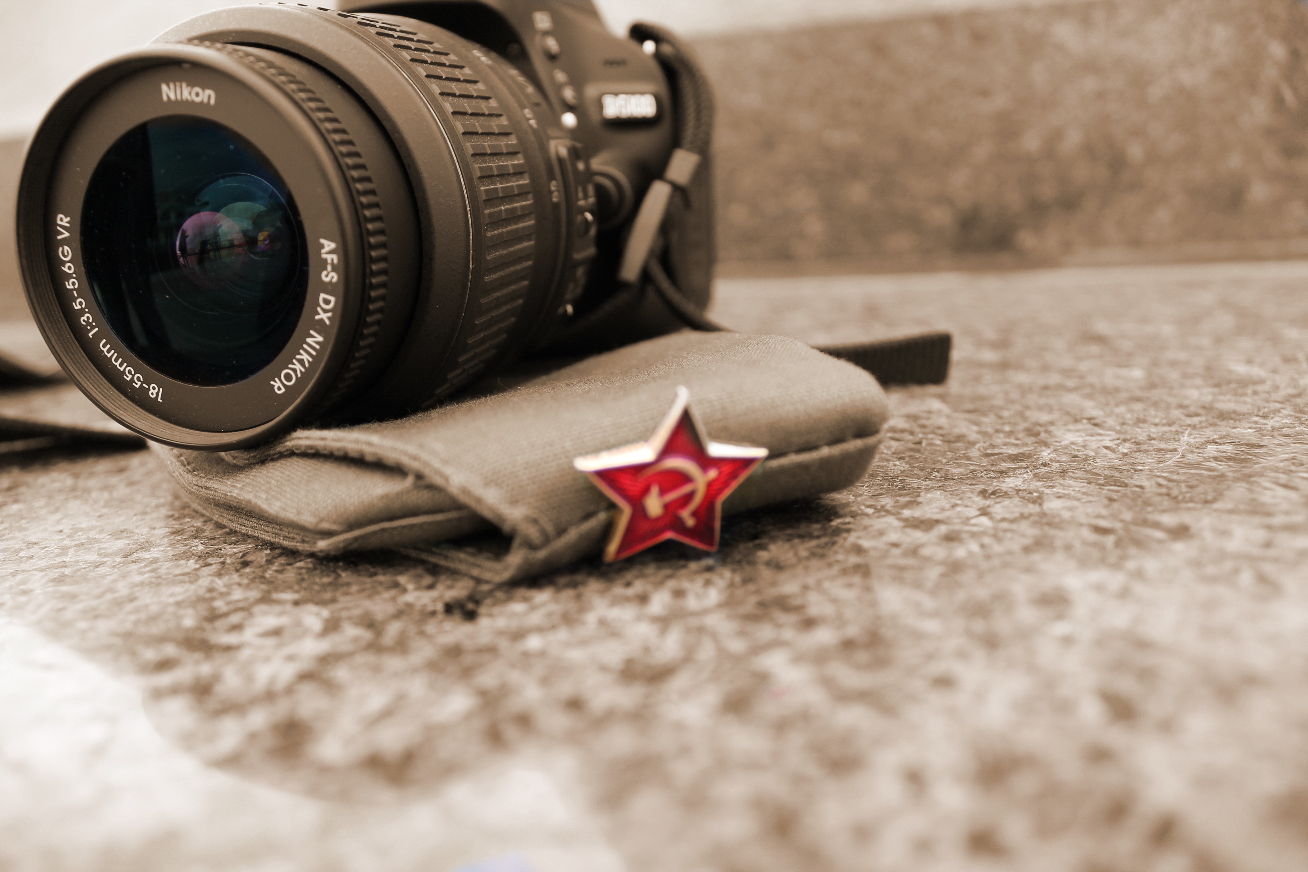 Nikon Camera Lens with Soviet Star Pin HD Wallpaper