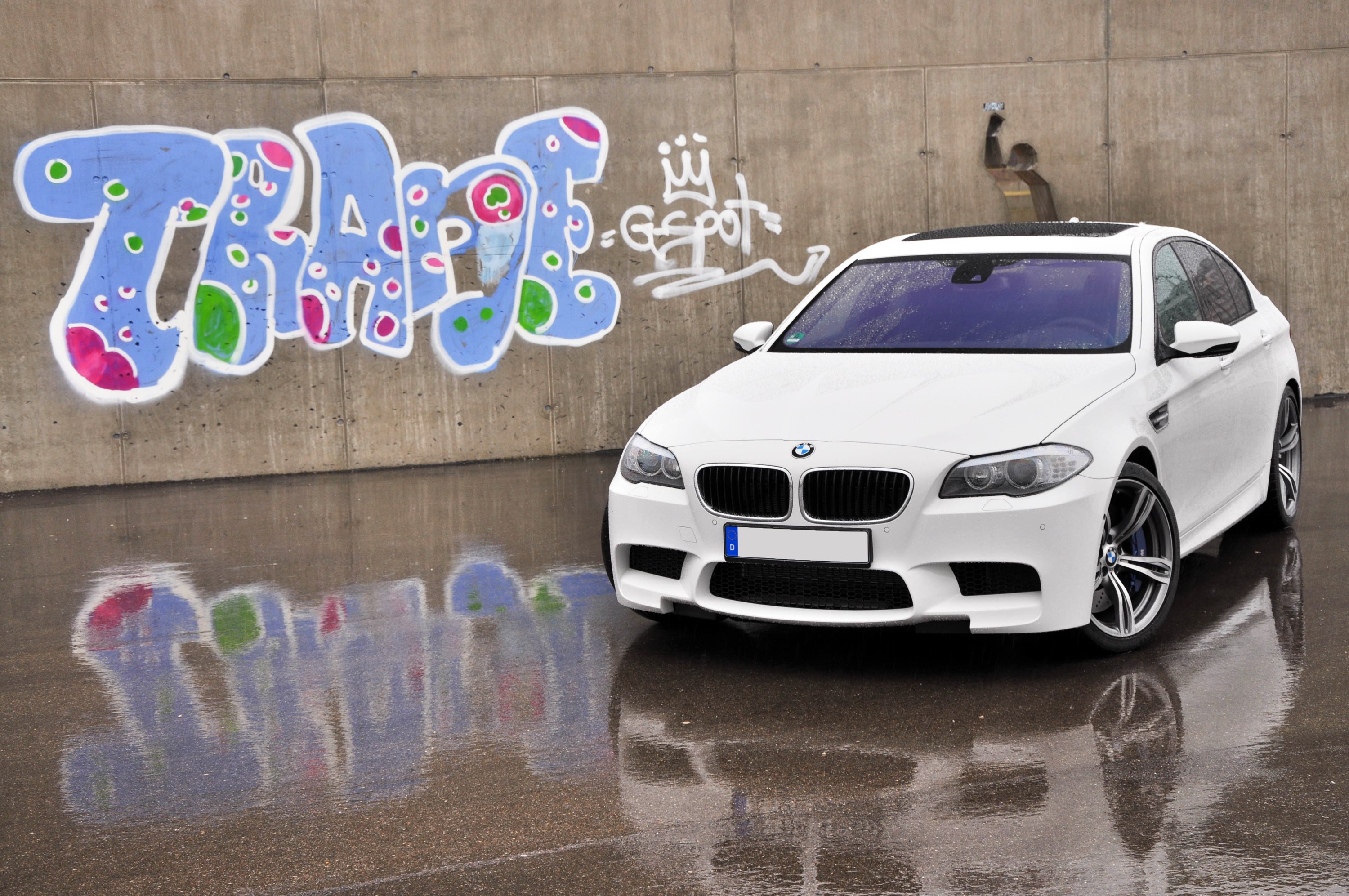 White BMW M5 F10 parked by graffiti wall HD Wallpaper