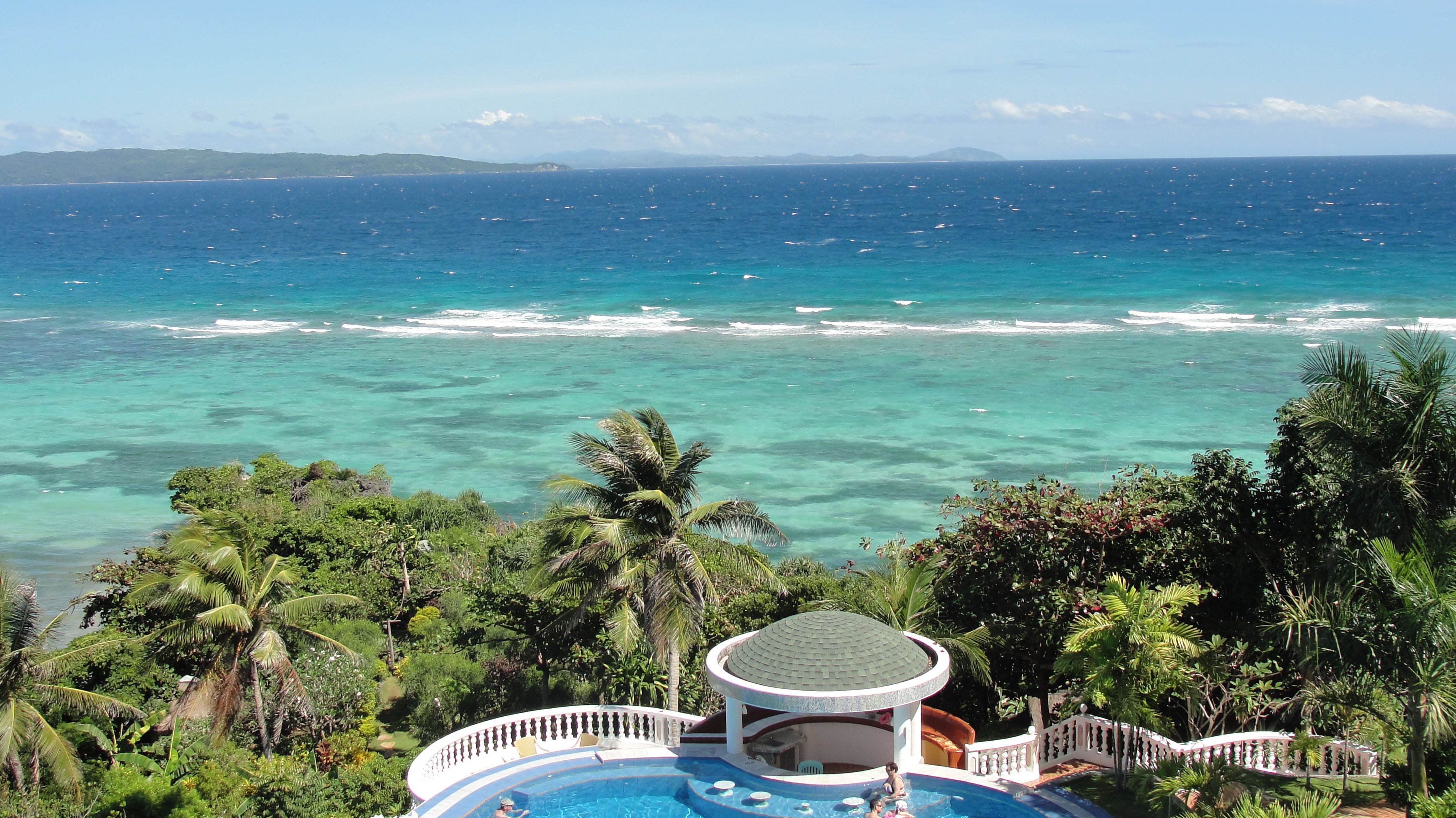 Tropical Resort Pool Overlooking the Ocean in Boracay, Philippines HD Wallpaper