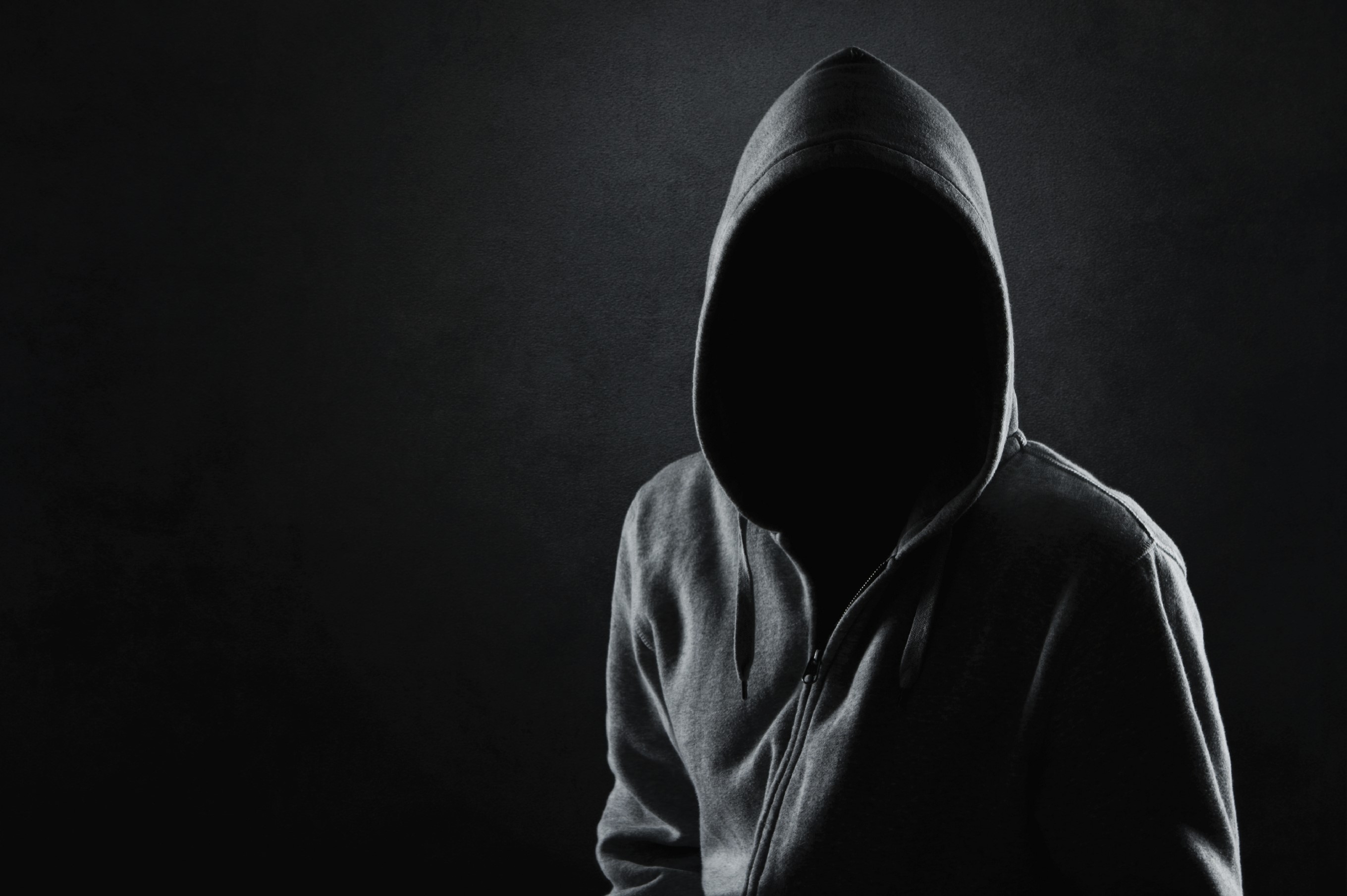 Person wearing a hooded sweatshirt HD Wallpaper
