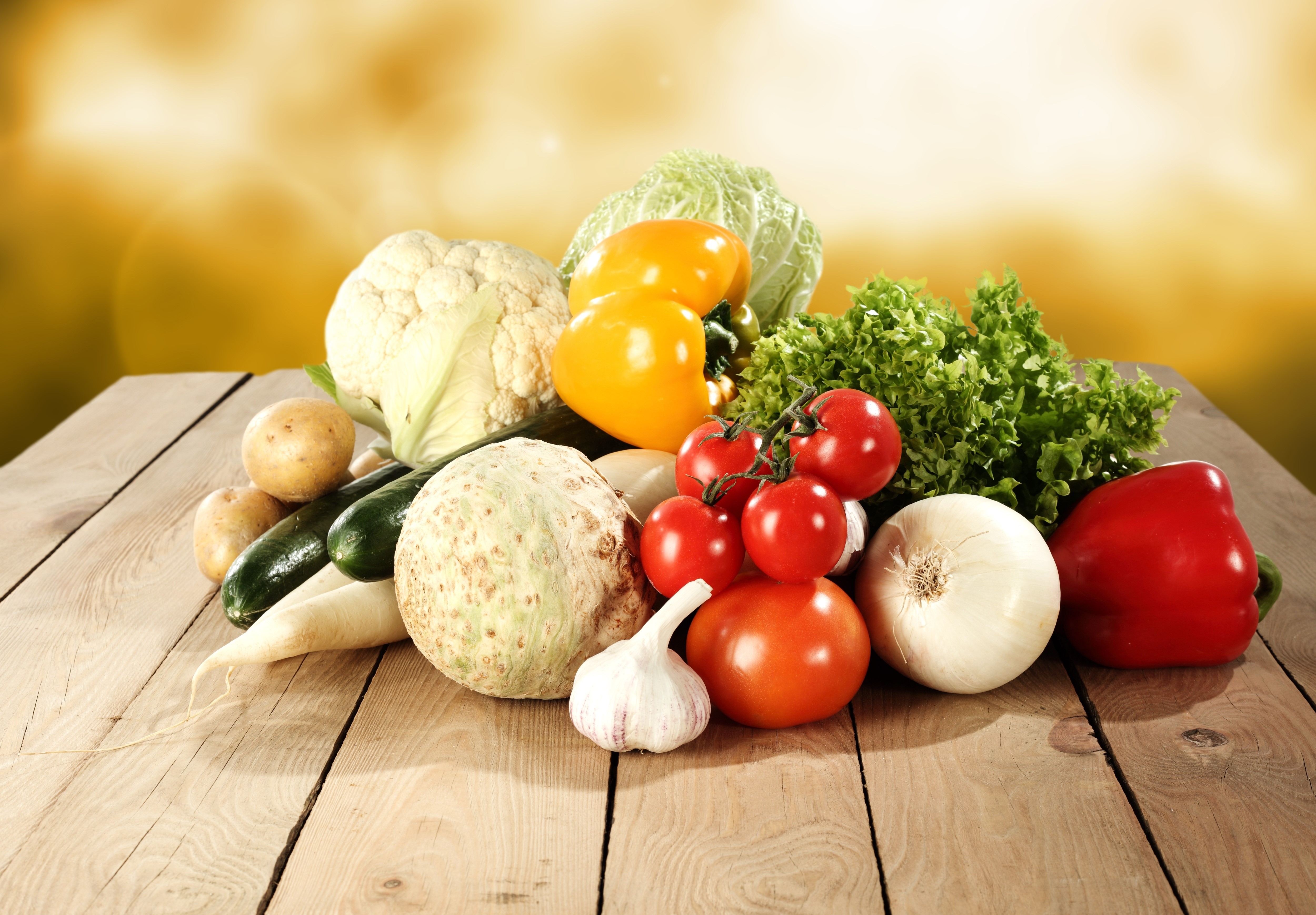 Assortment of fresh vegetables on a wooden table HD Wallpaper