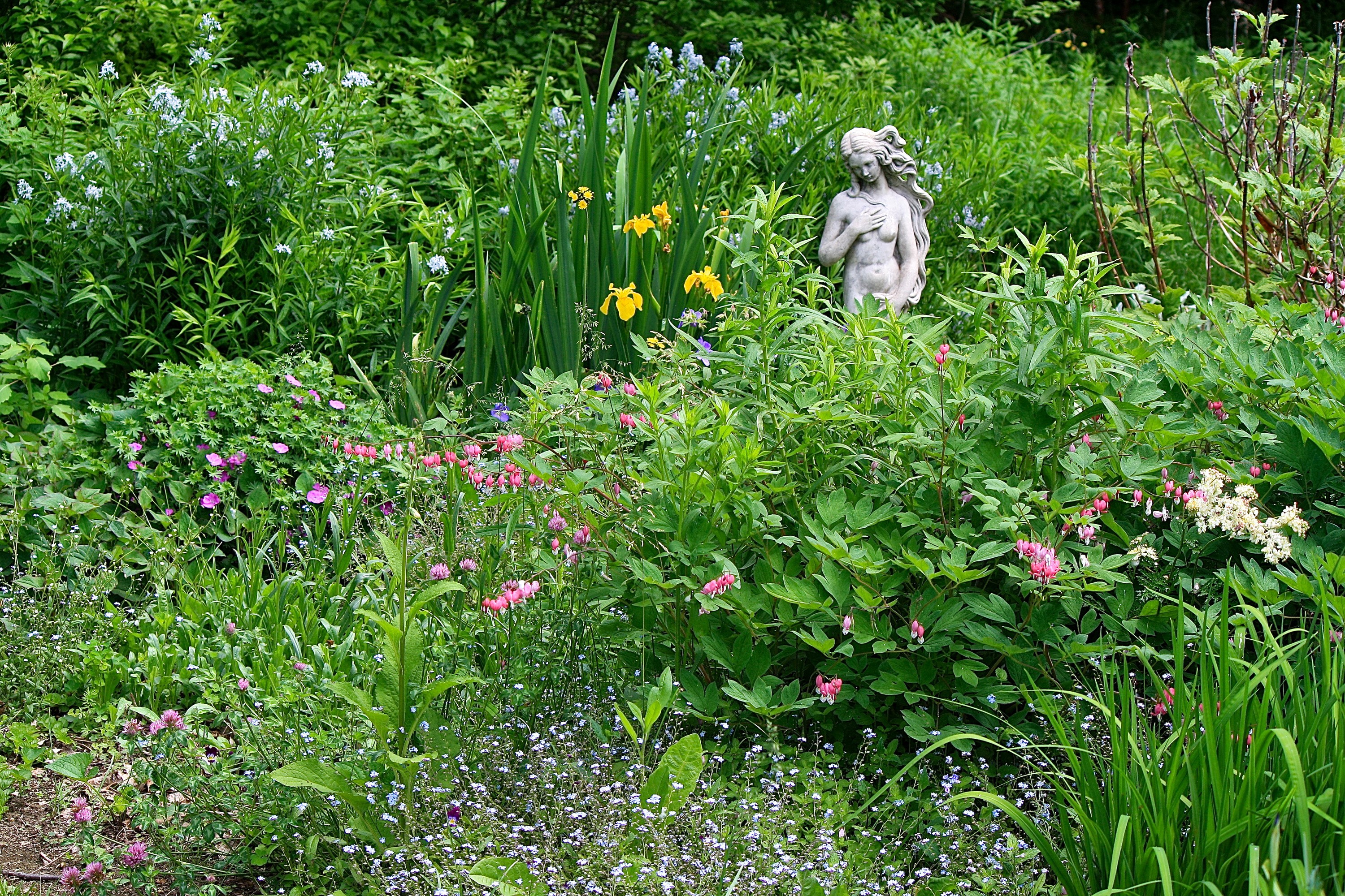 Garden with a nude statue and flowers HD Wallpaper