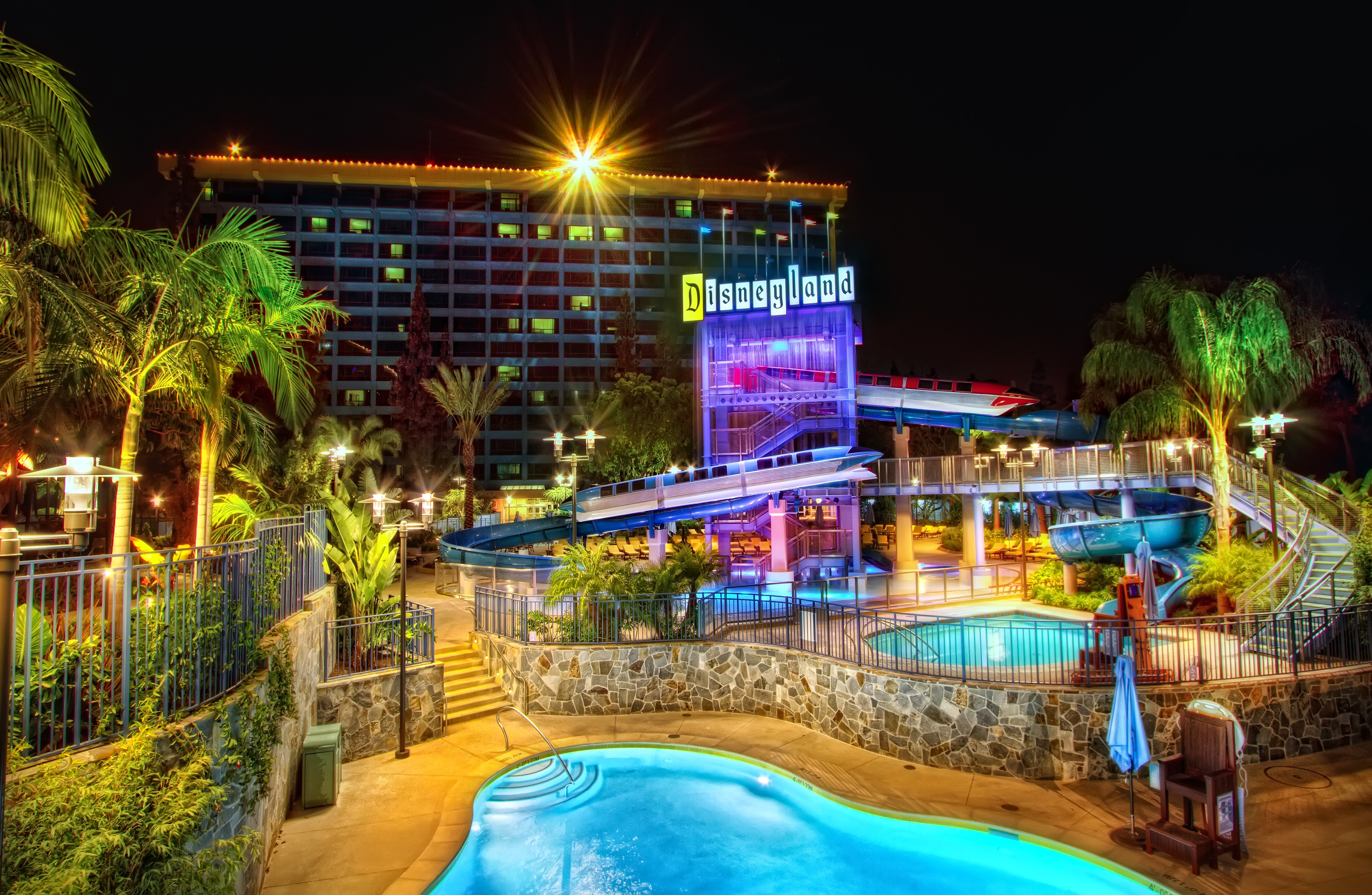 Disneyland Hotel Pools and Water Slides at Night HD Wallpaper