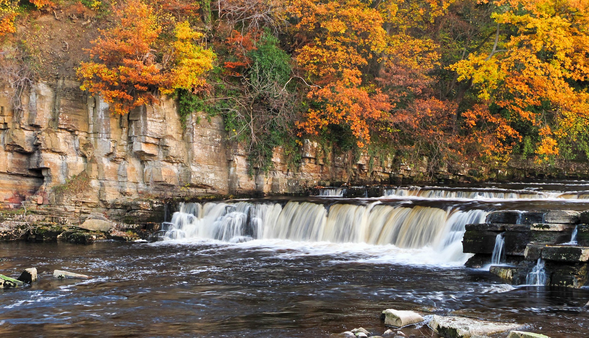 Waterfall in Autumn with Rocky Cliffs HD Wallpaper