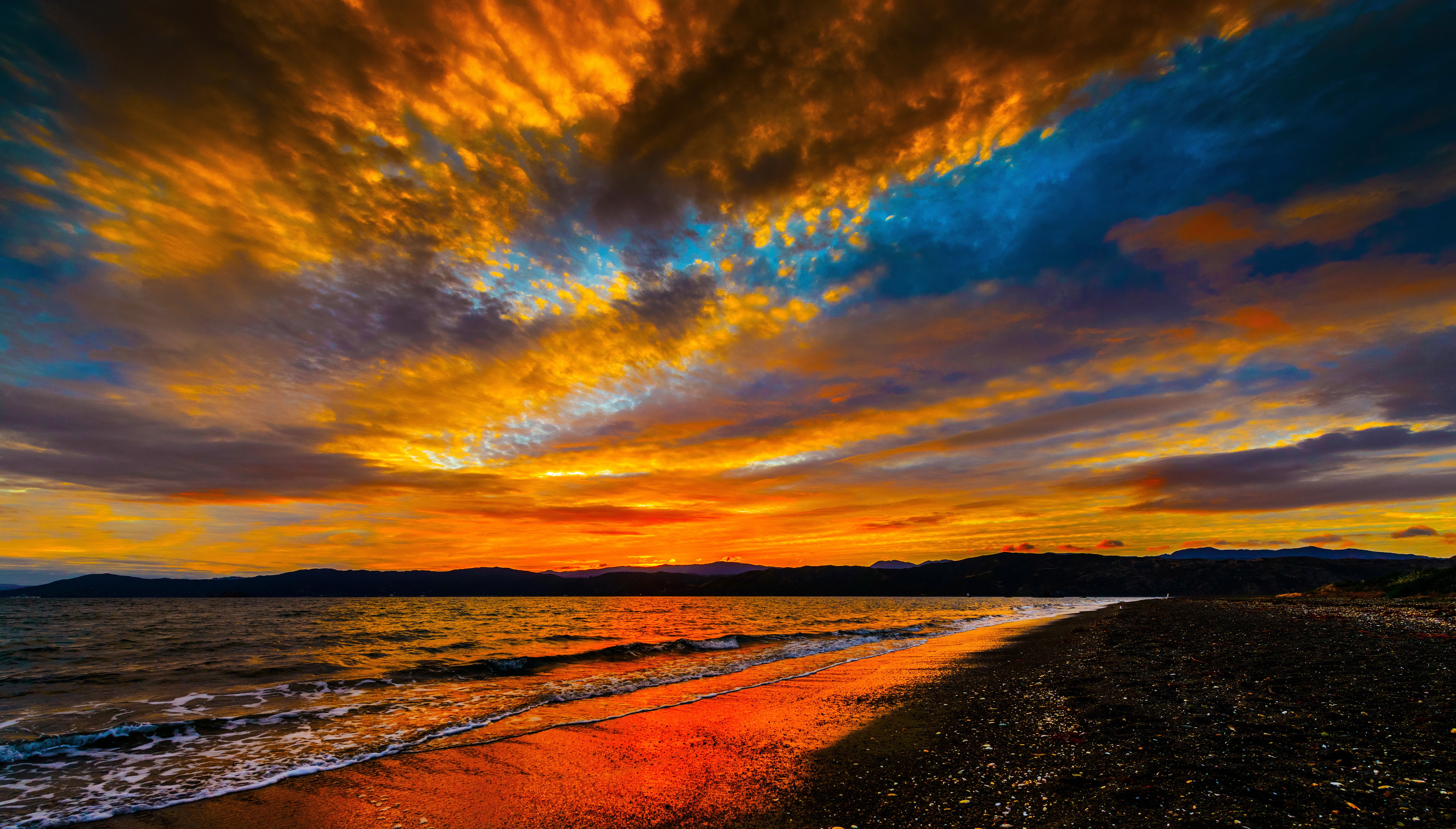 Sunset over the sea with dramatic clouds HD Wallpaper