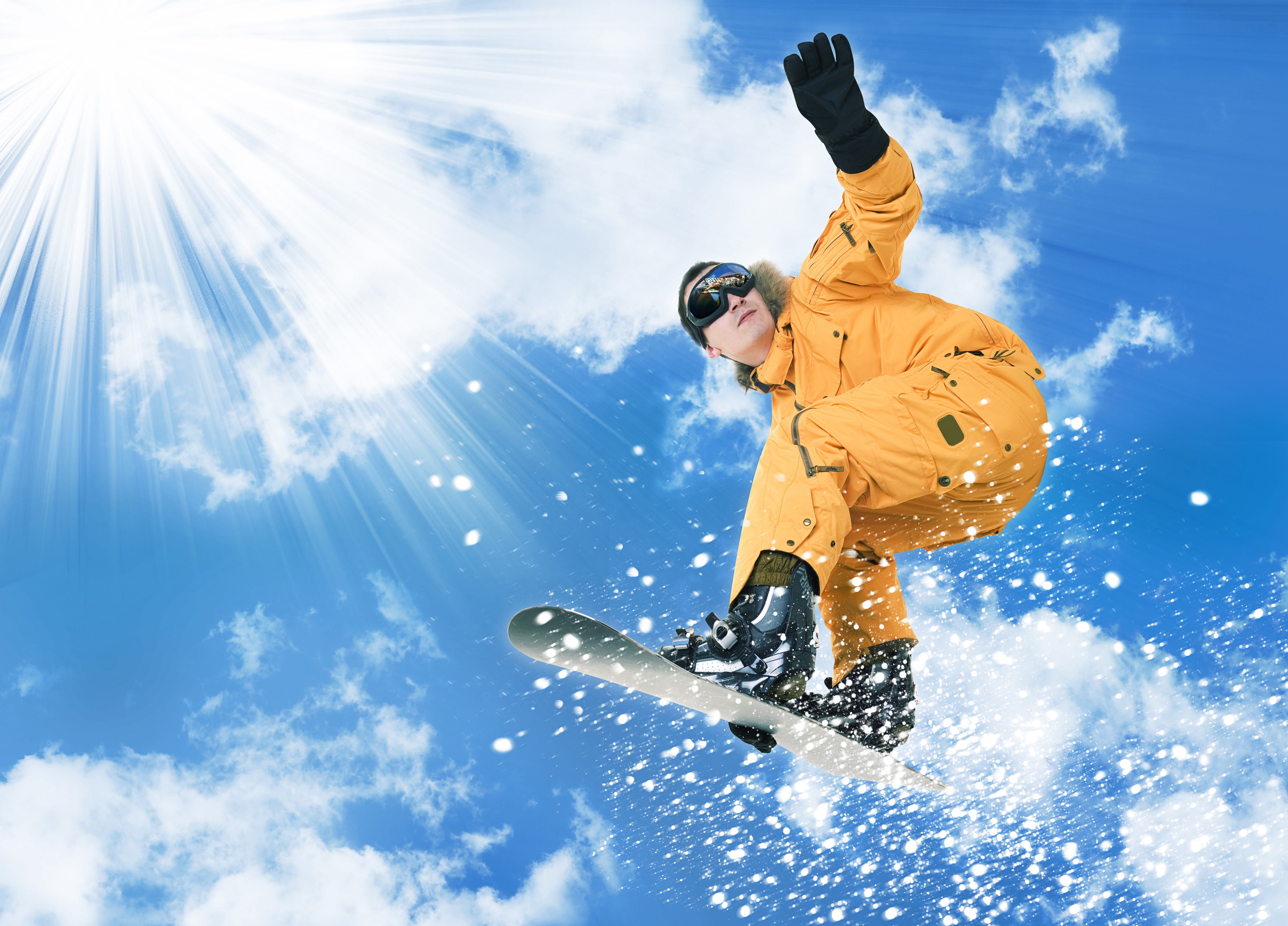 Snowboarder jumping in the sky with sun rays HD Wallpaper