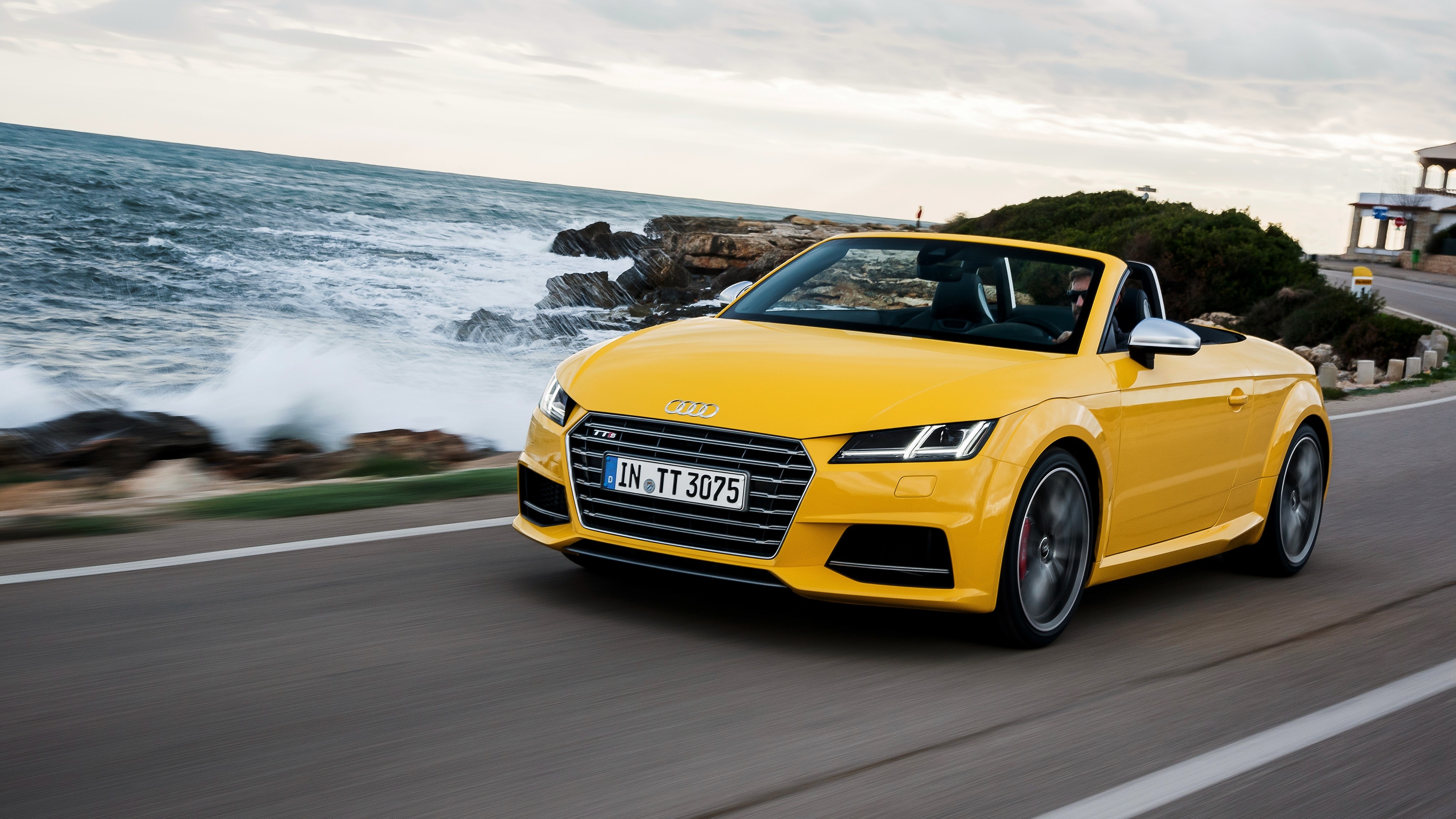 Yellow Audi TTS Roadster driving by the sea HD Wallpaper