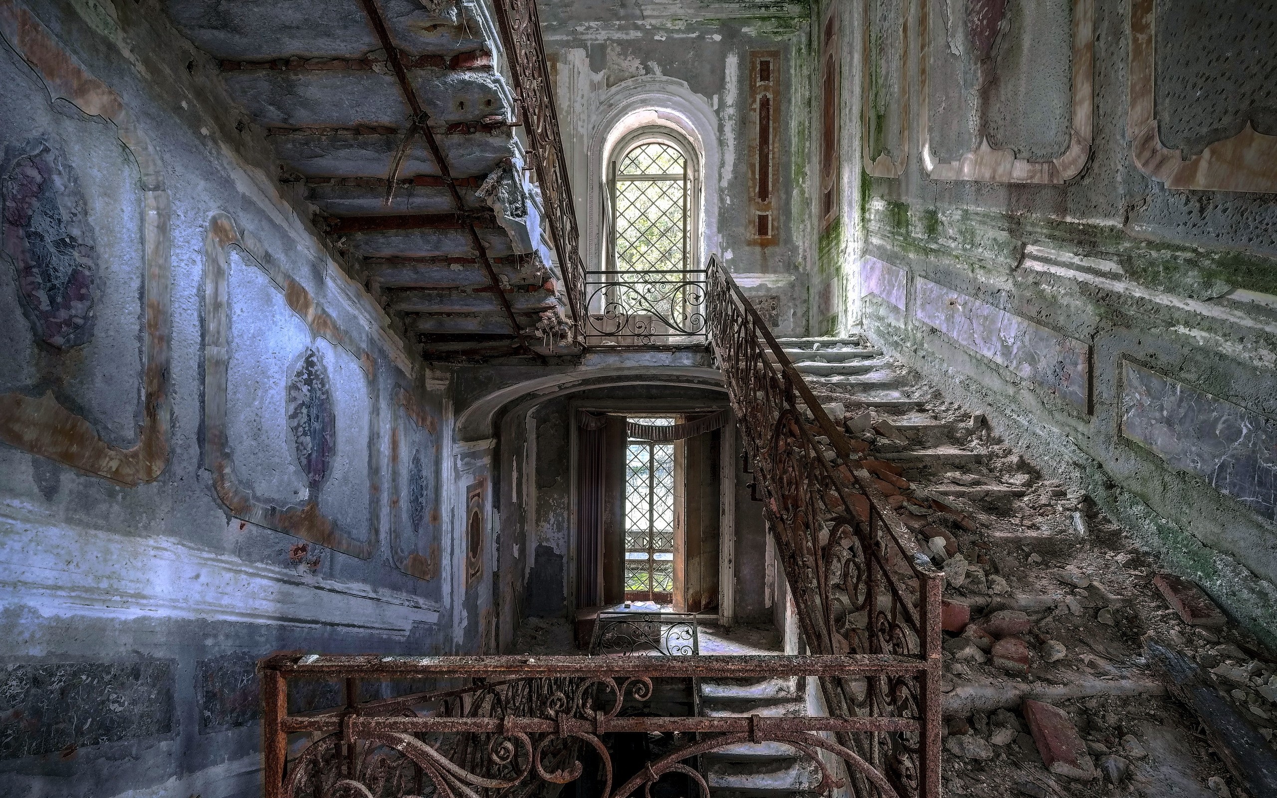 Abandoned building interior with decaying staircase HD Wallpaper