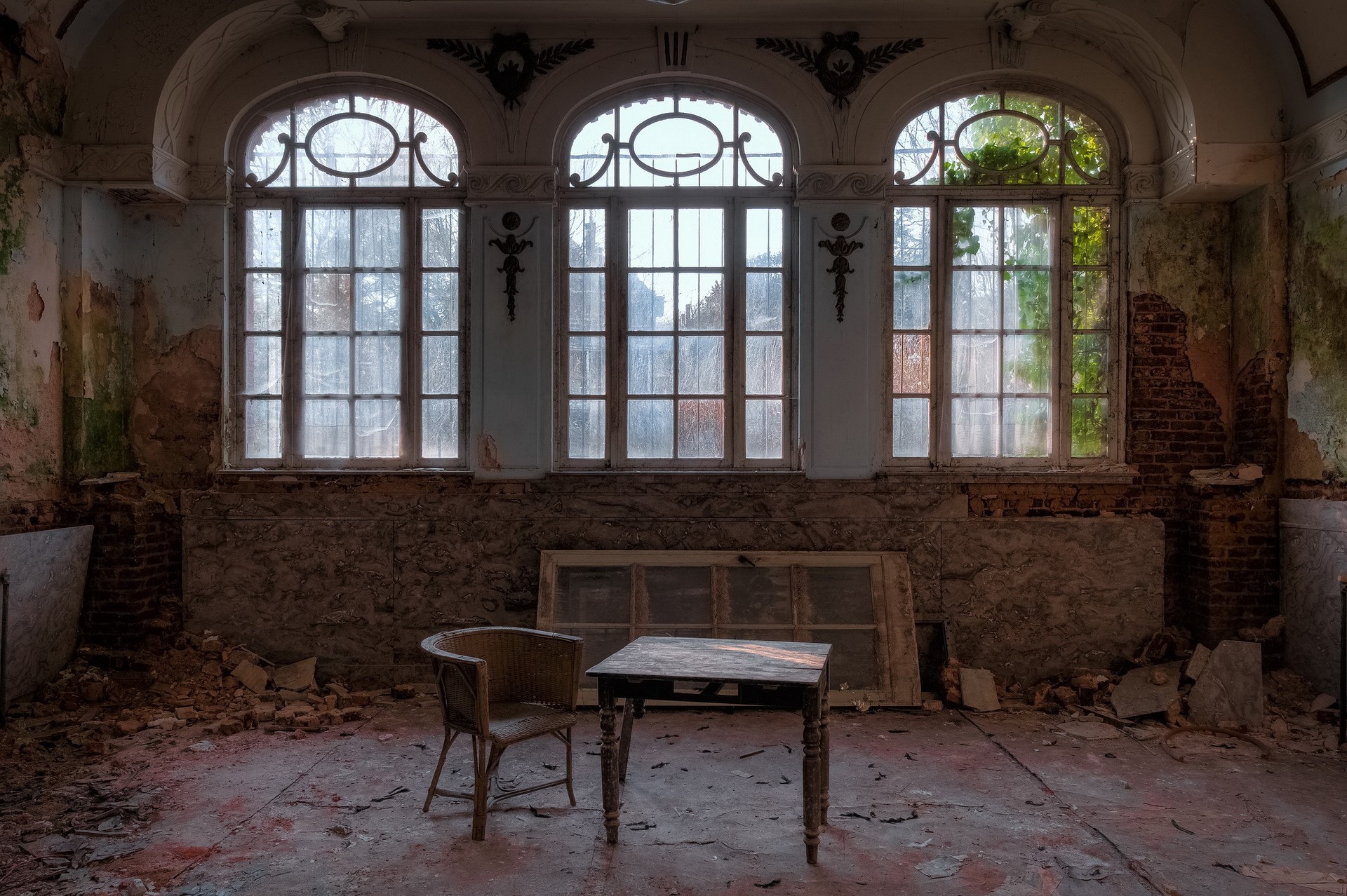 Abandoned room with large windows, chair, and table HD Wallpaper