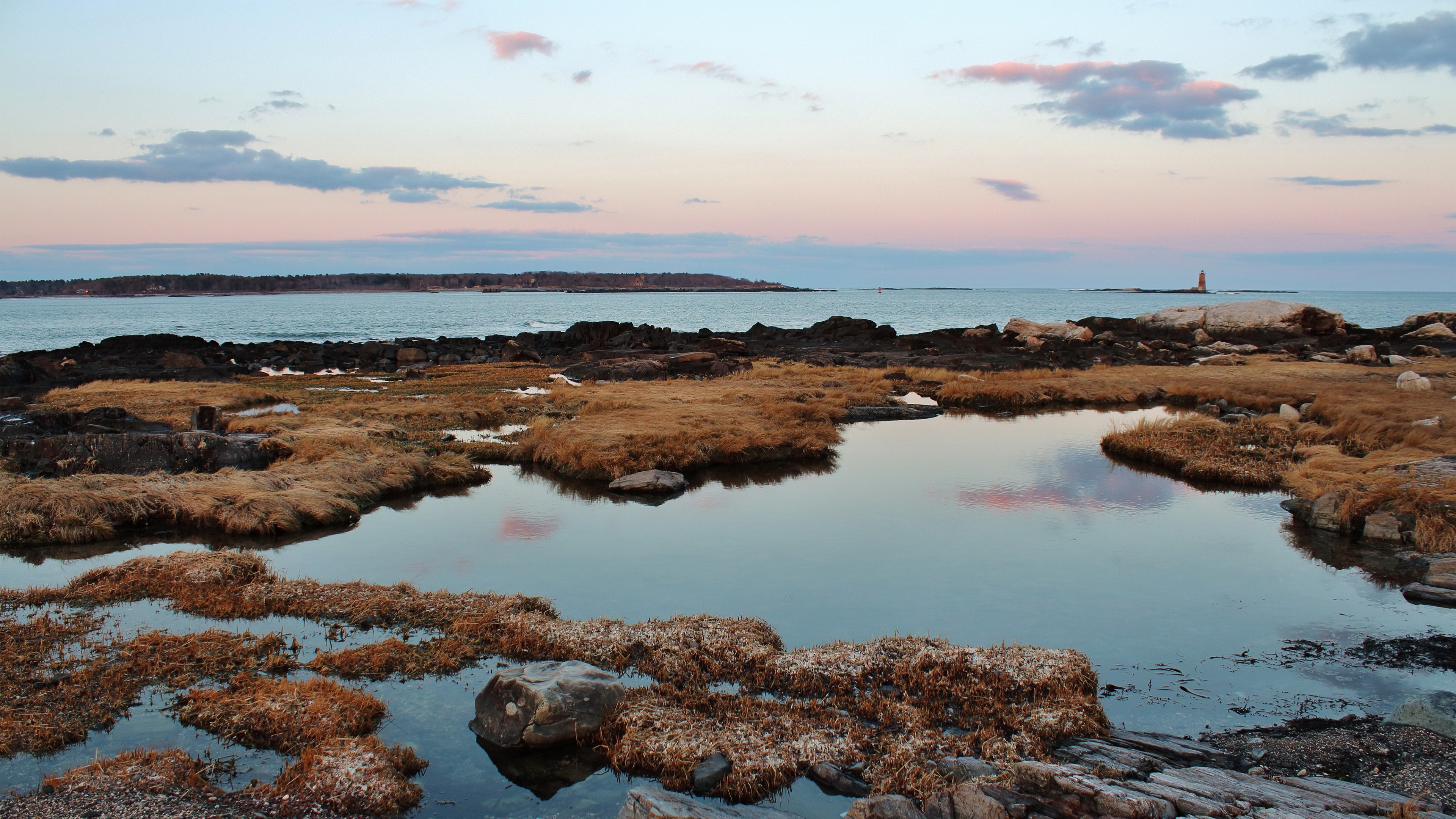 Coastal landscape with tide pools and lighthouse HD Wallpaper