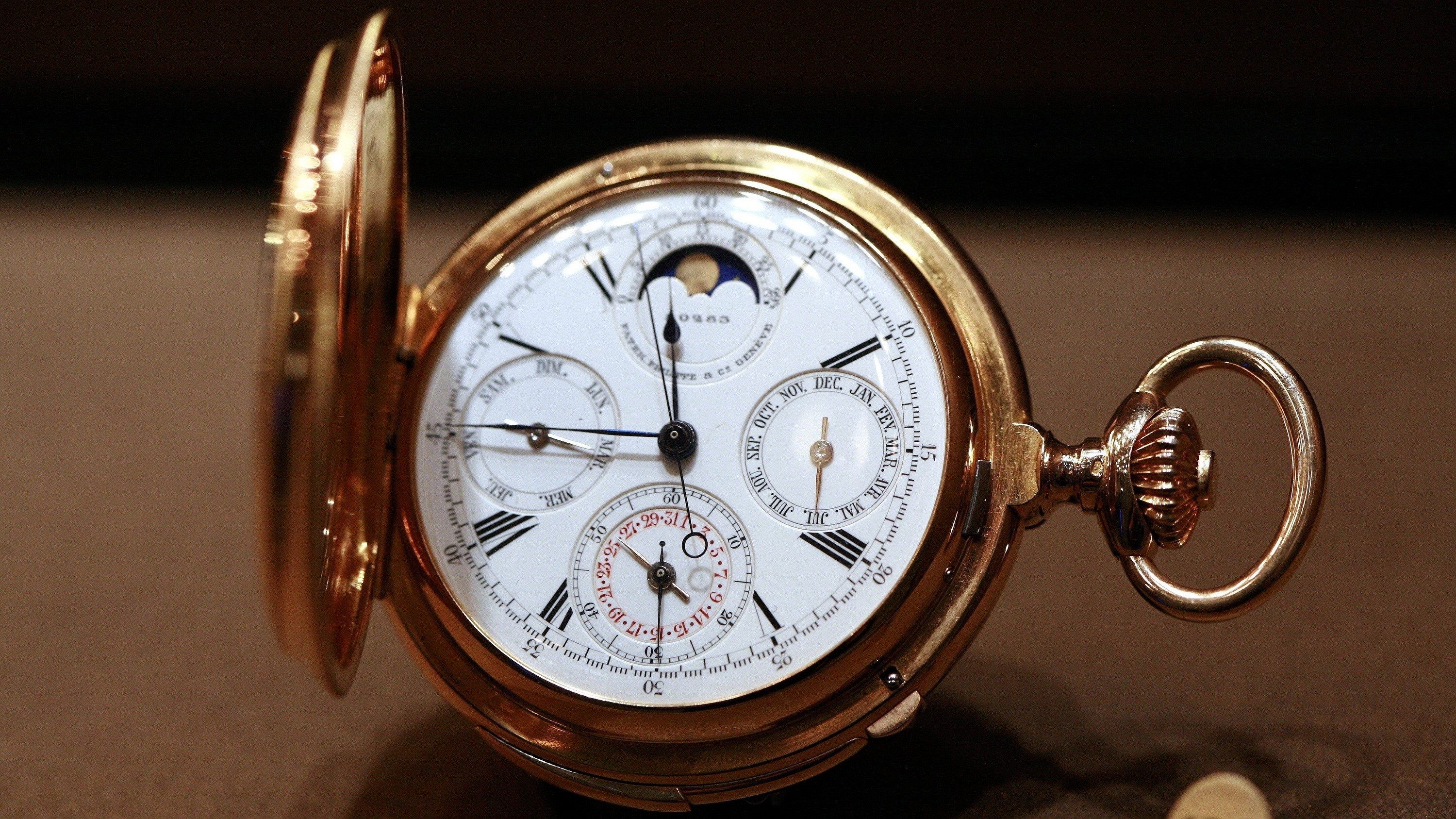 Gold pocket watch with multiple dials HD Wallpaper