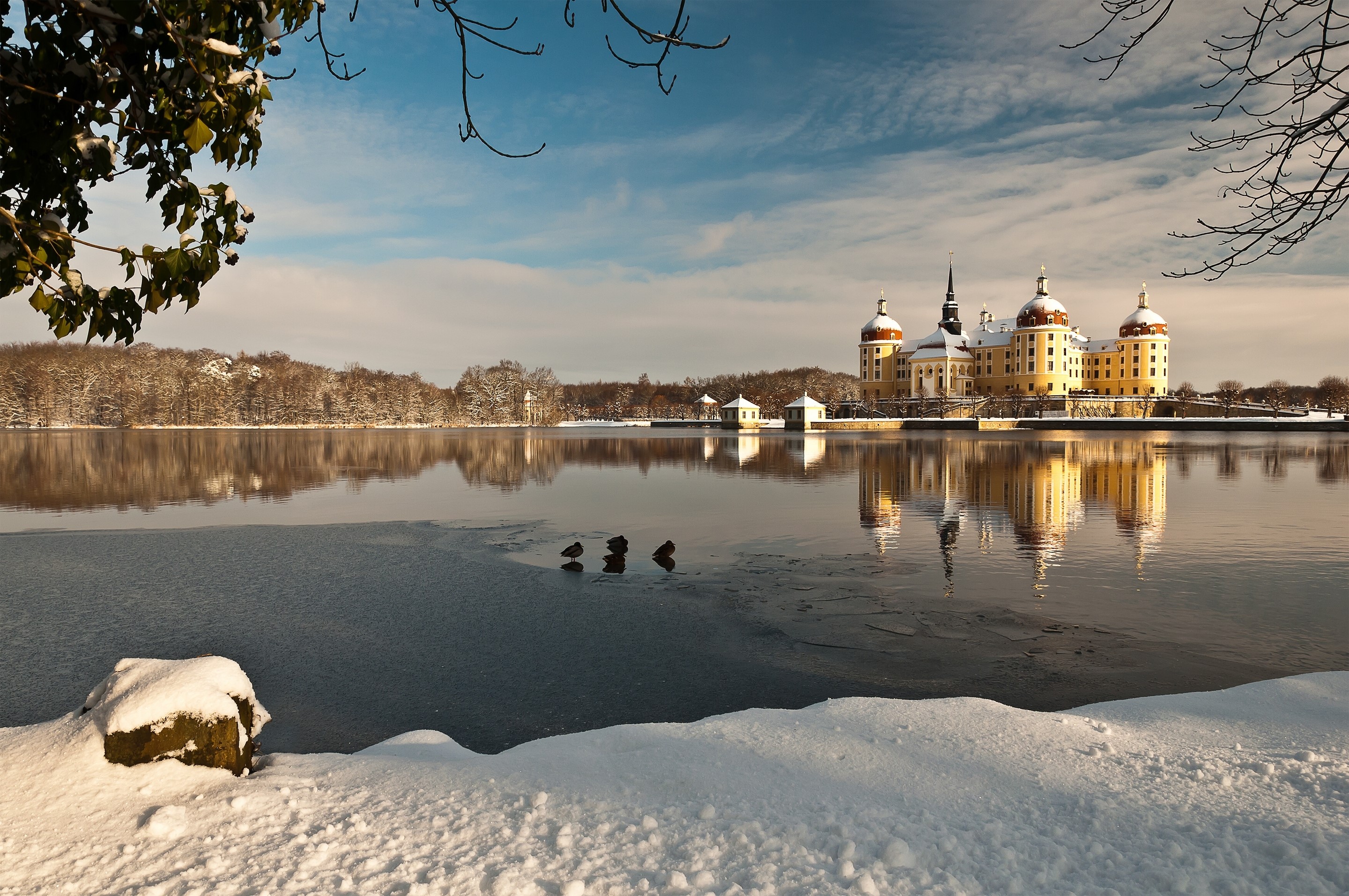 Moritzburg Castle reflected in a frozen lake in winter HD Wallpaper