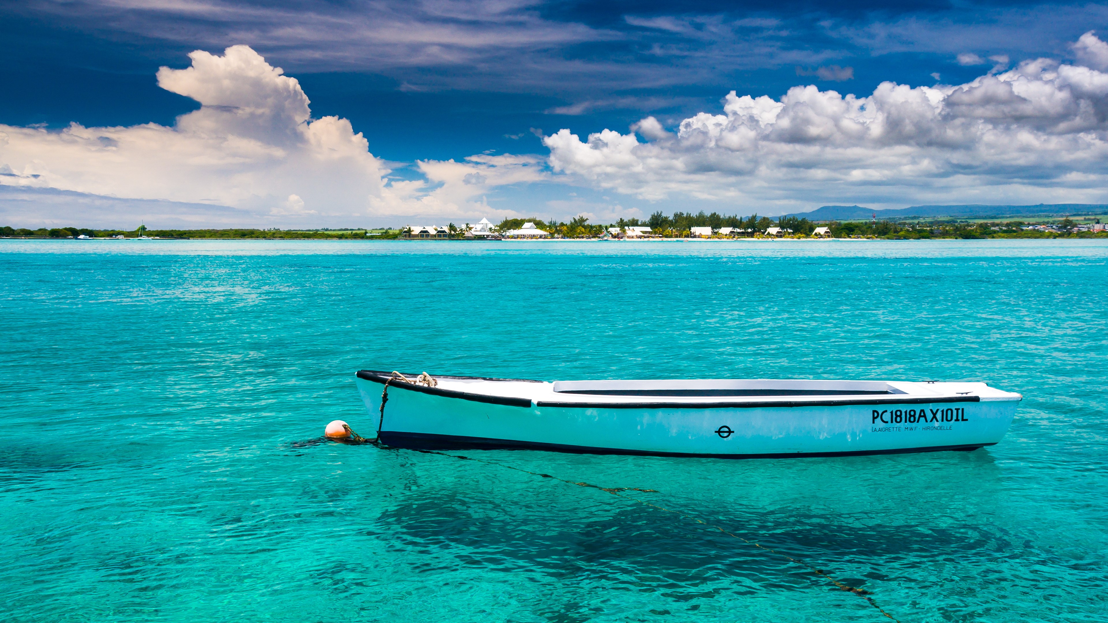 White boat on turquoise water with island in background HD Wallpaper