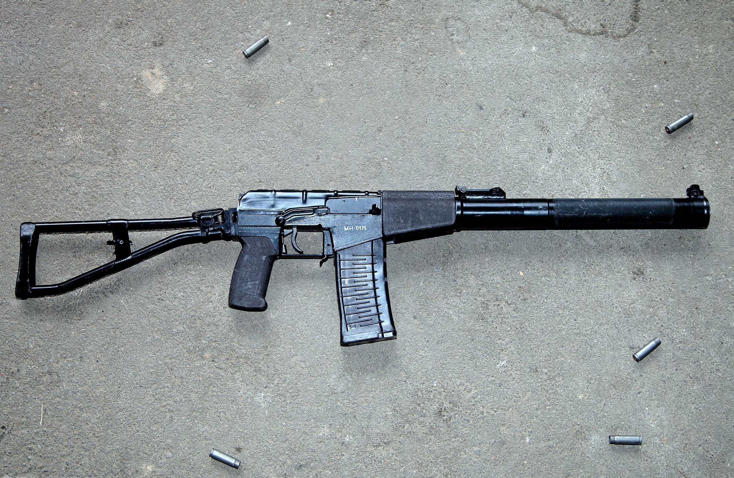 VSS Vintorez assault rifle with spent casings HD Wallpaper