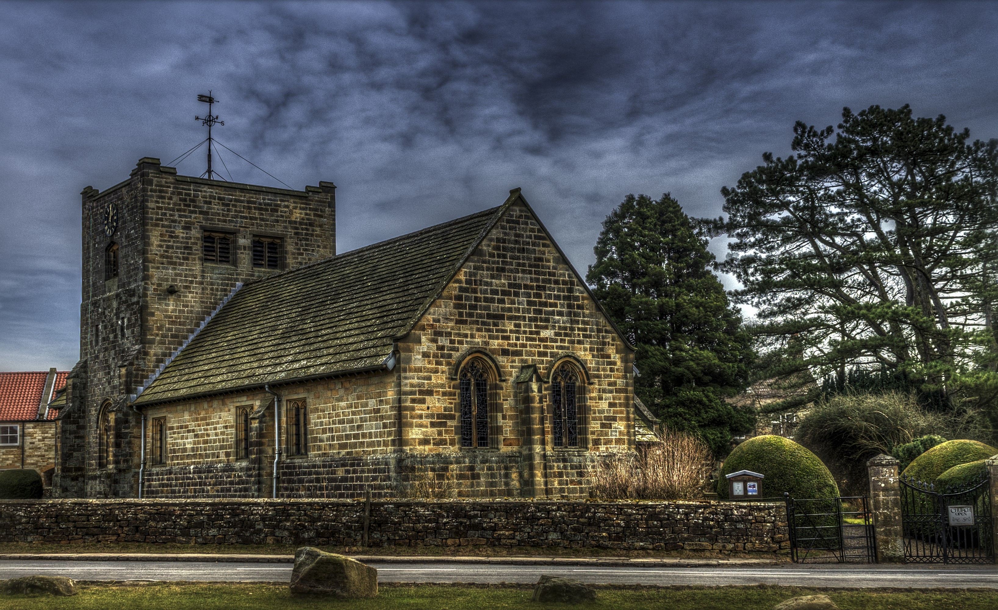 Stone church with tower and fence HD Wallpaper