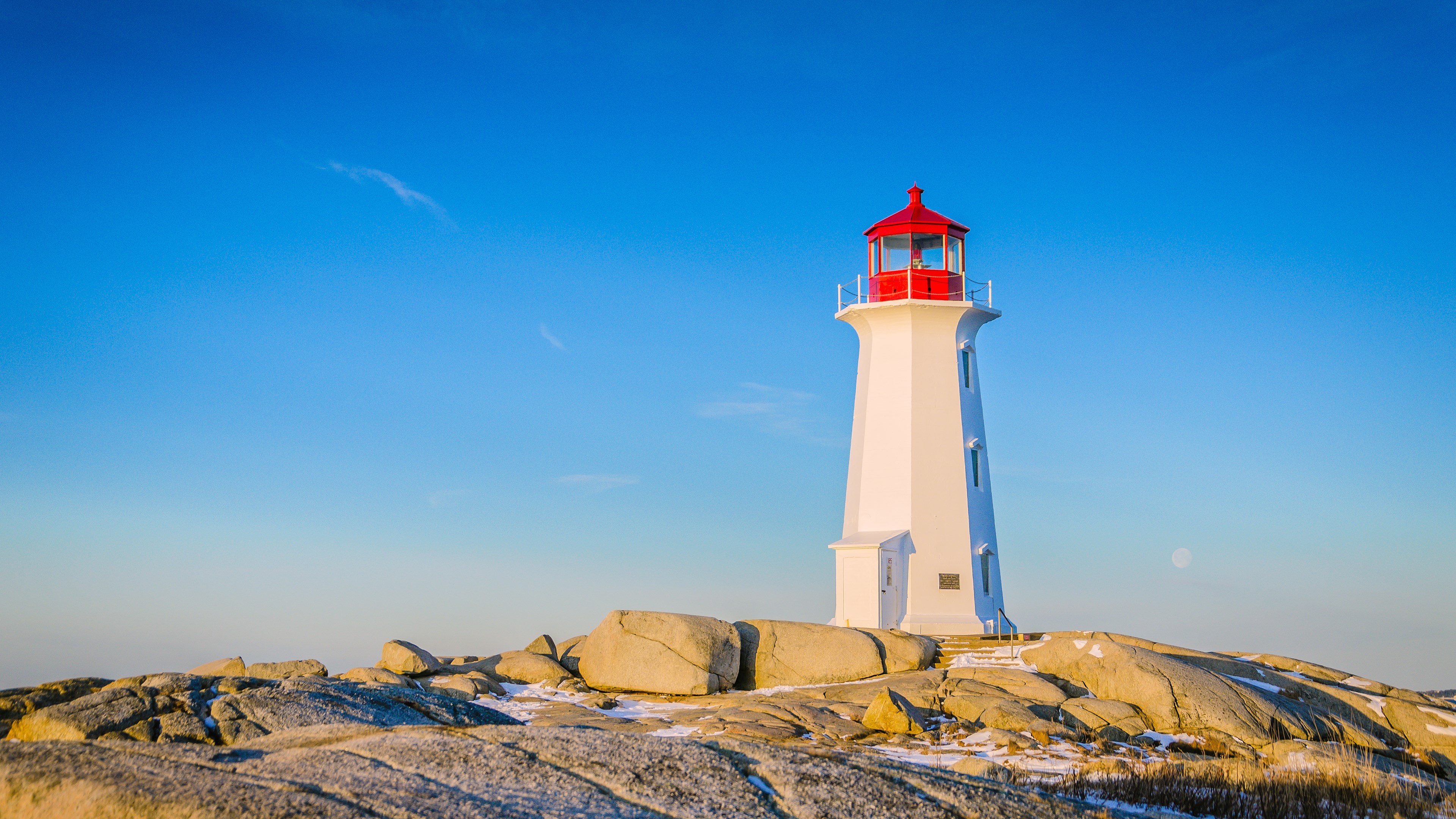 Peggy's Cove Lighthouse under a clear blue sky HD Wallpaper