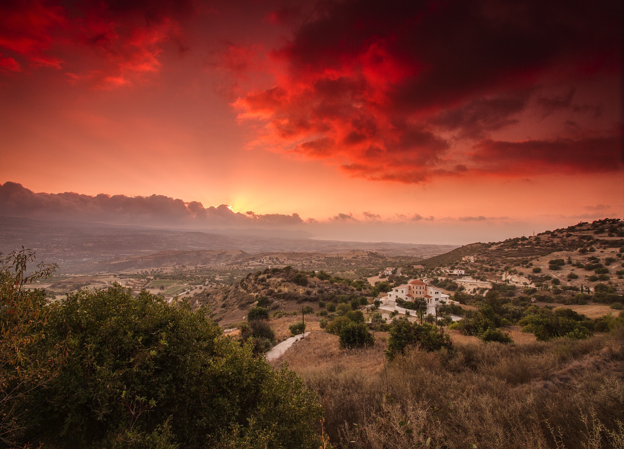Houses in a valley at sunset HD Wallpaper