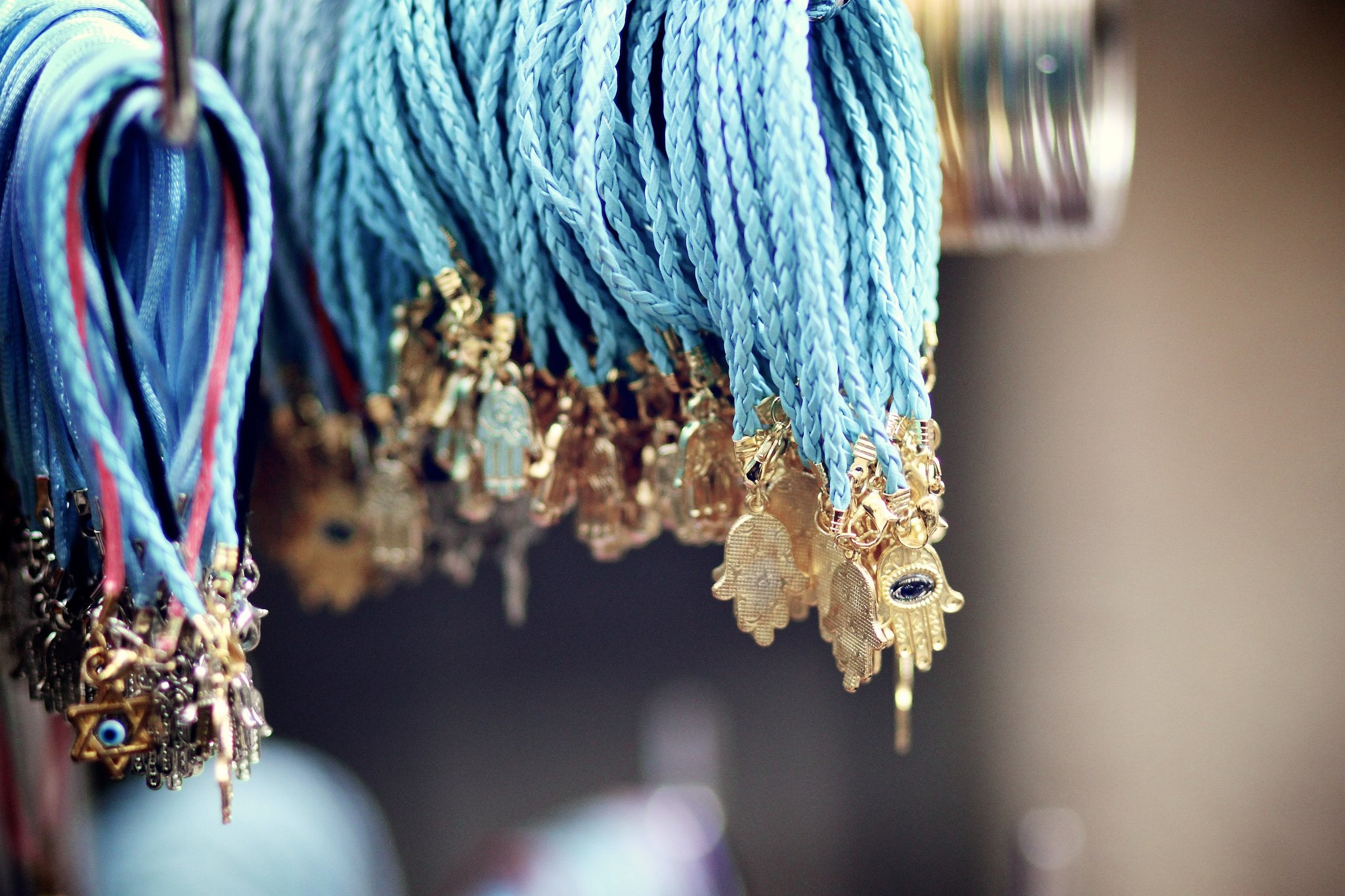 Blue braided strings with hamsa and Star of David charms HD Wallpaper