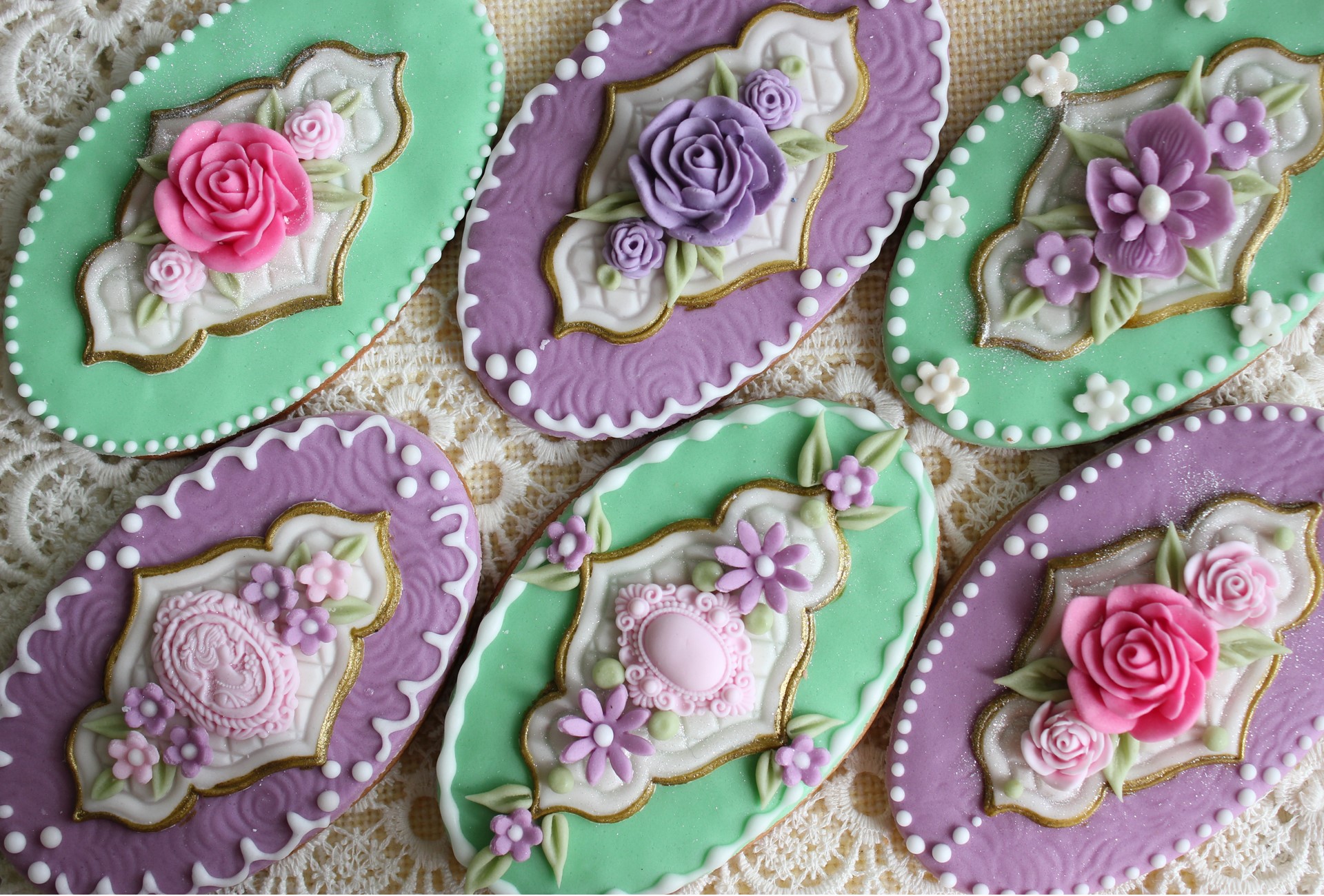 Decorated oval cookies with floral icing HD Wallpaper