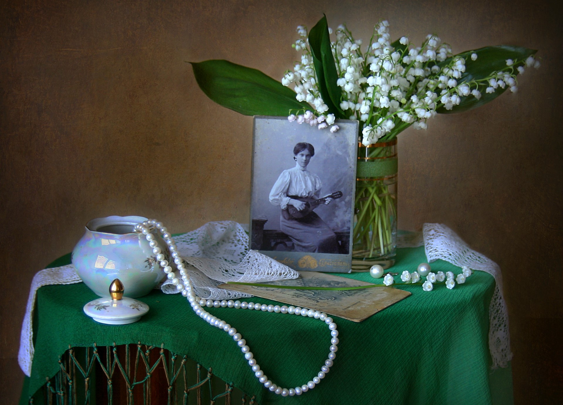 Still-life with lilies of the valley and vintage photo HD Wallpaper