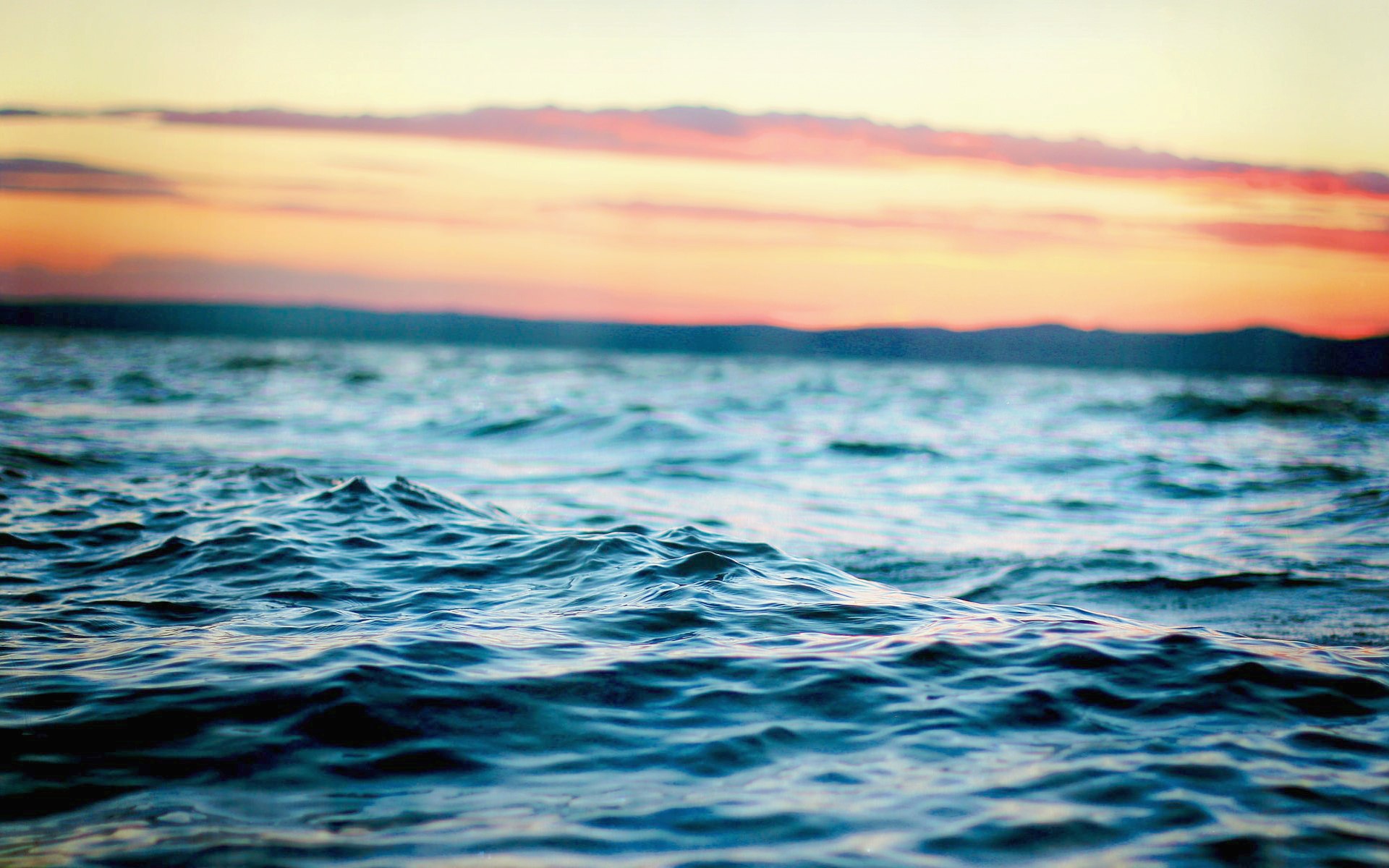 Ocean waves at sunset with colorful sky HD Wallpaper