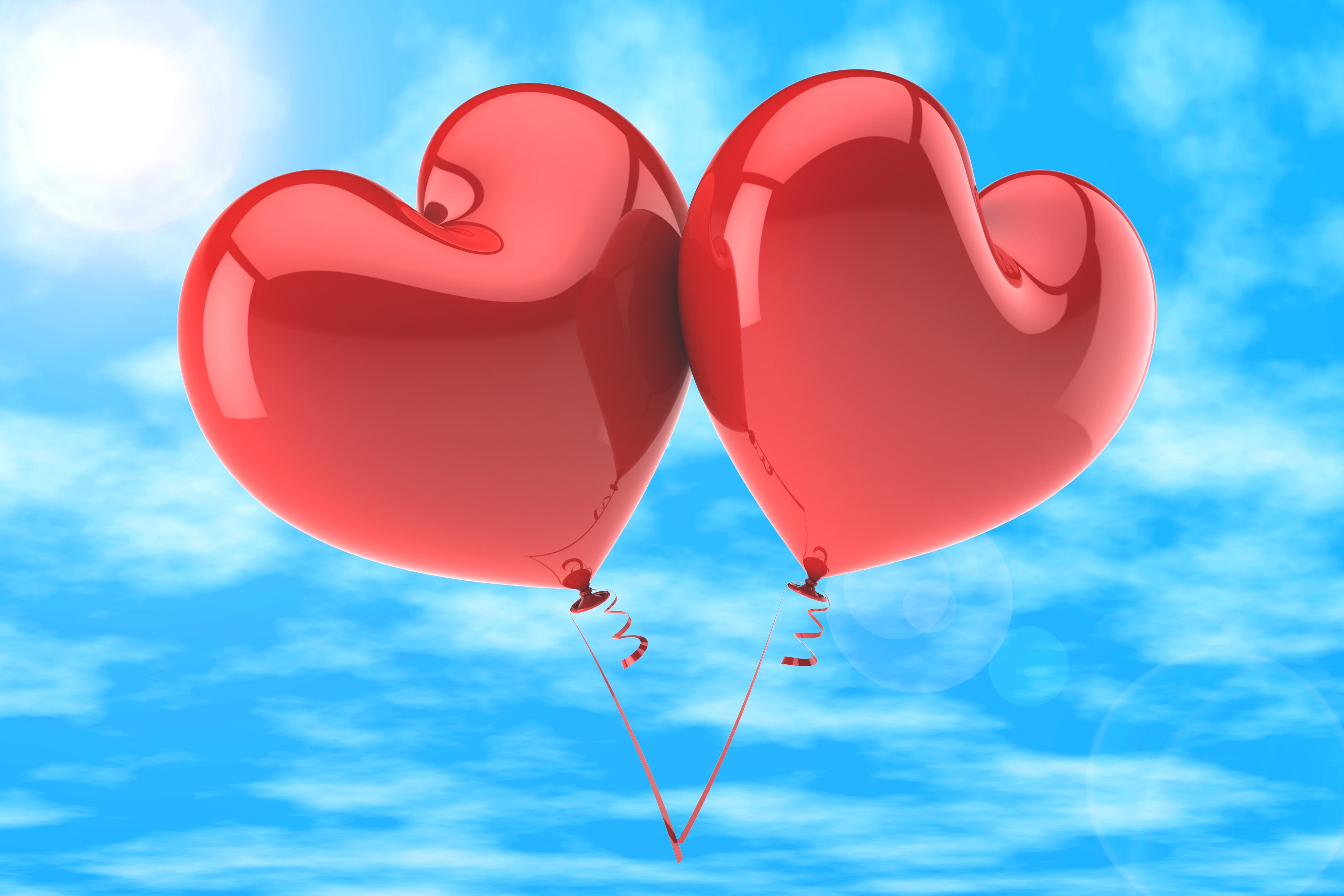 Two red heart balloons in the sky HD Wallpaper