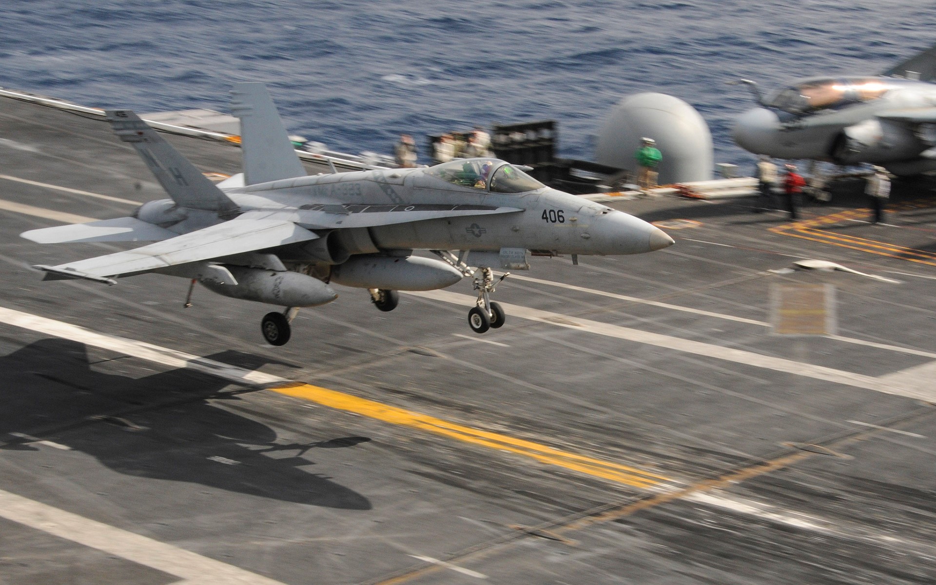 Fighter jet landing on aircraft carrier HD Wallpaper