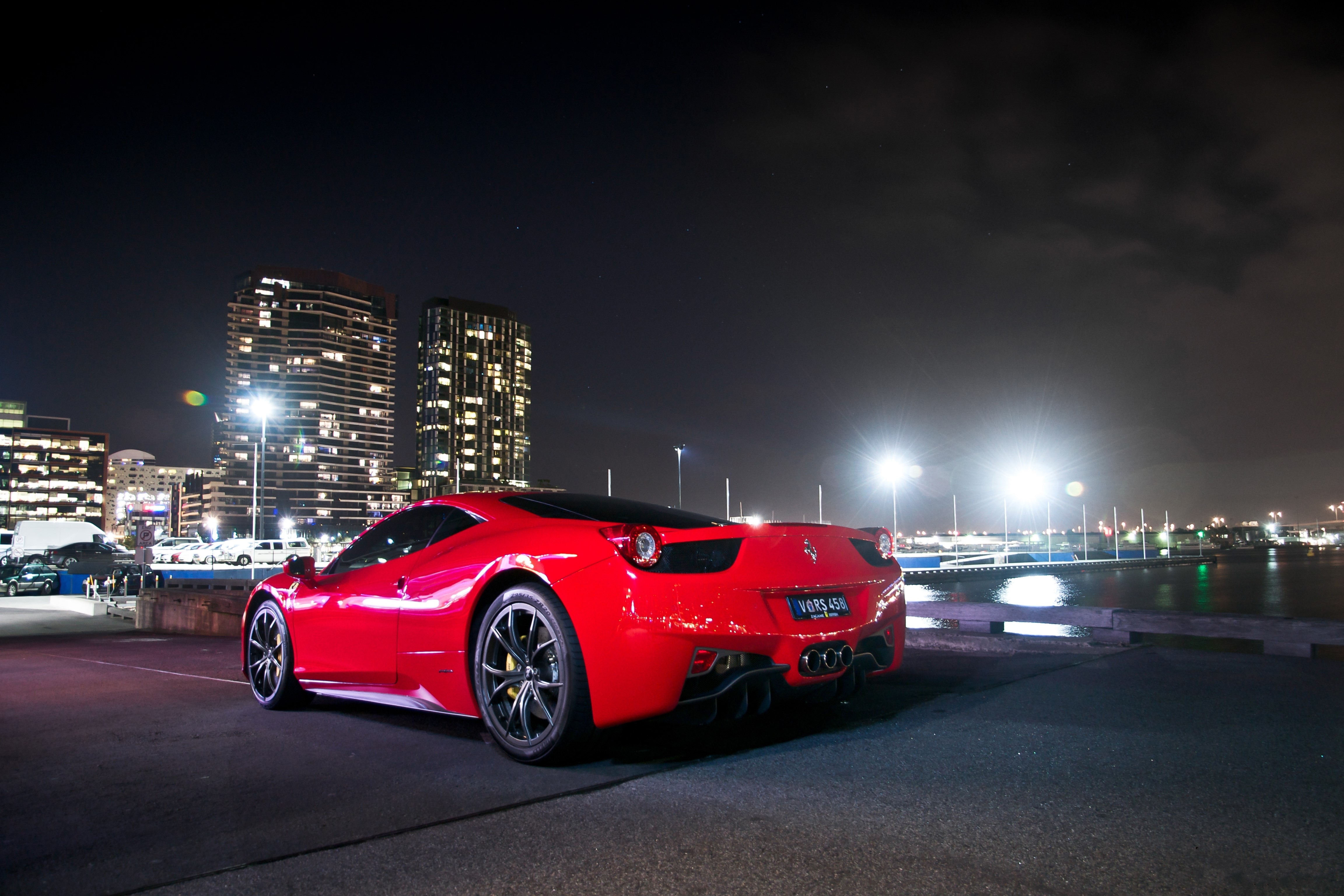 Red Ferrari 458 at Night with City Skyline HD Wallpaper
