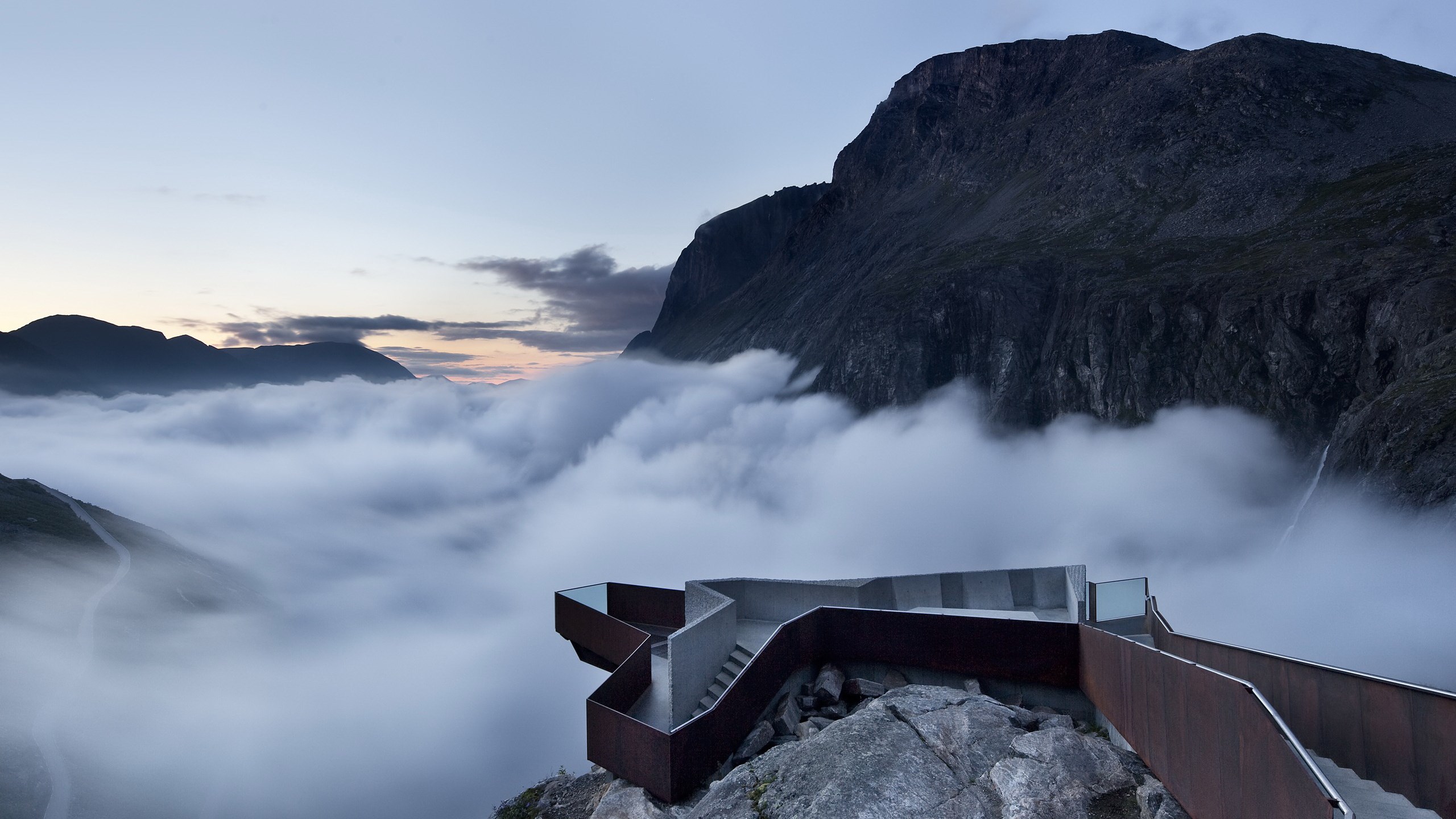 Modern viewing platform over a foggy mountain valley HD Wallpaper