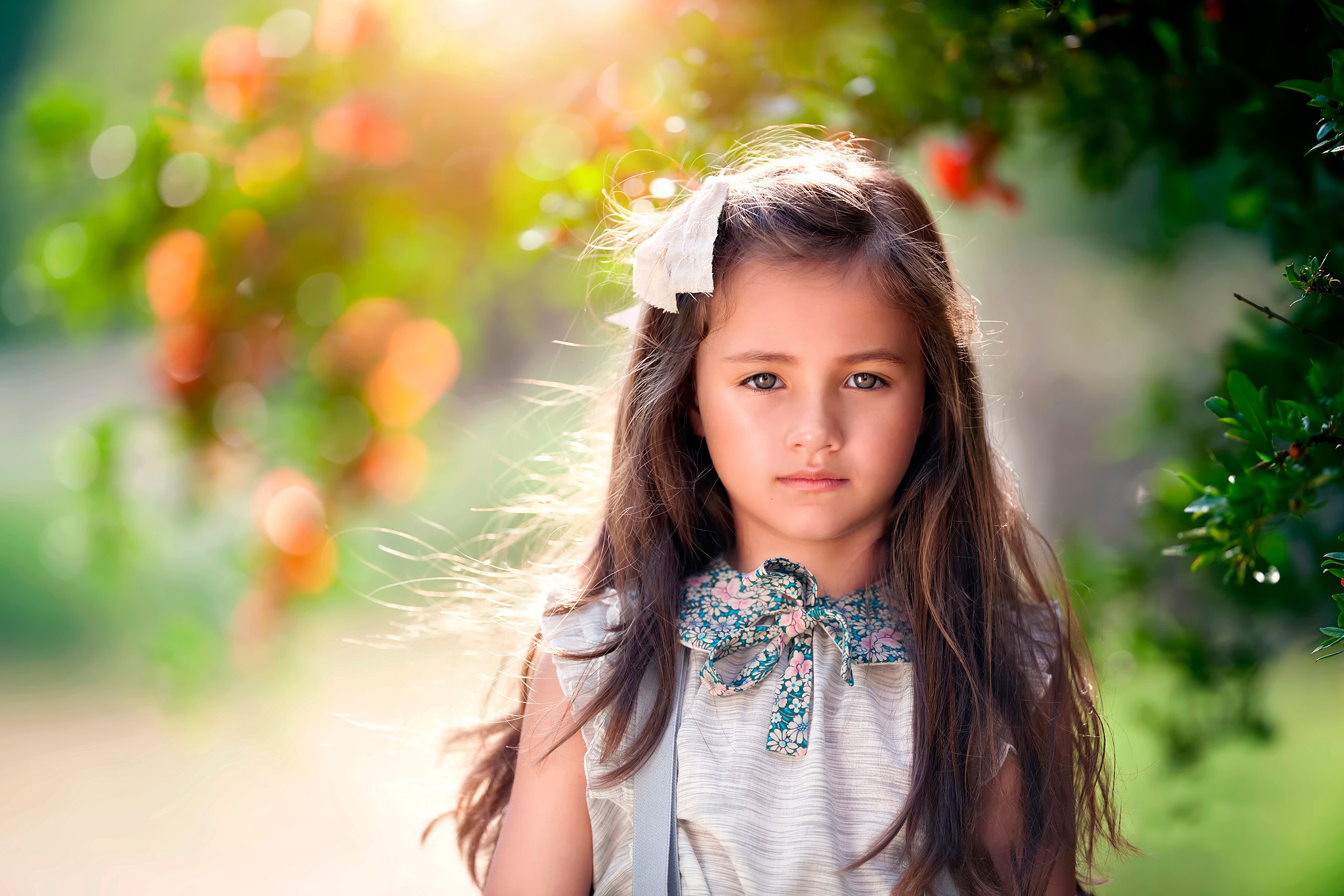 Young girl with brown hair and a bow in her hair HD Wallpaper