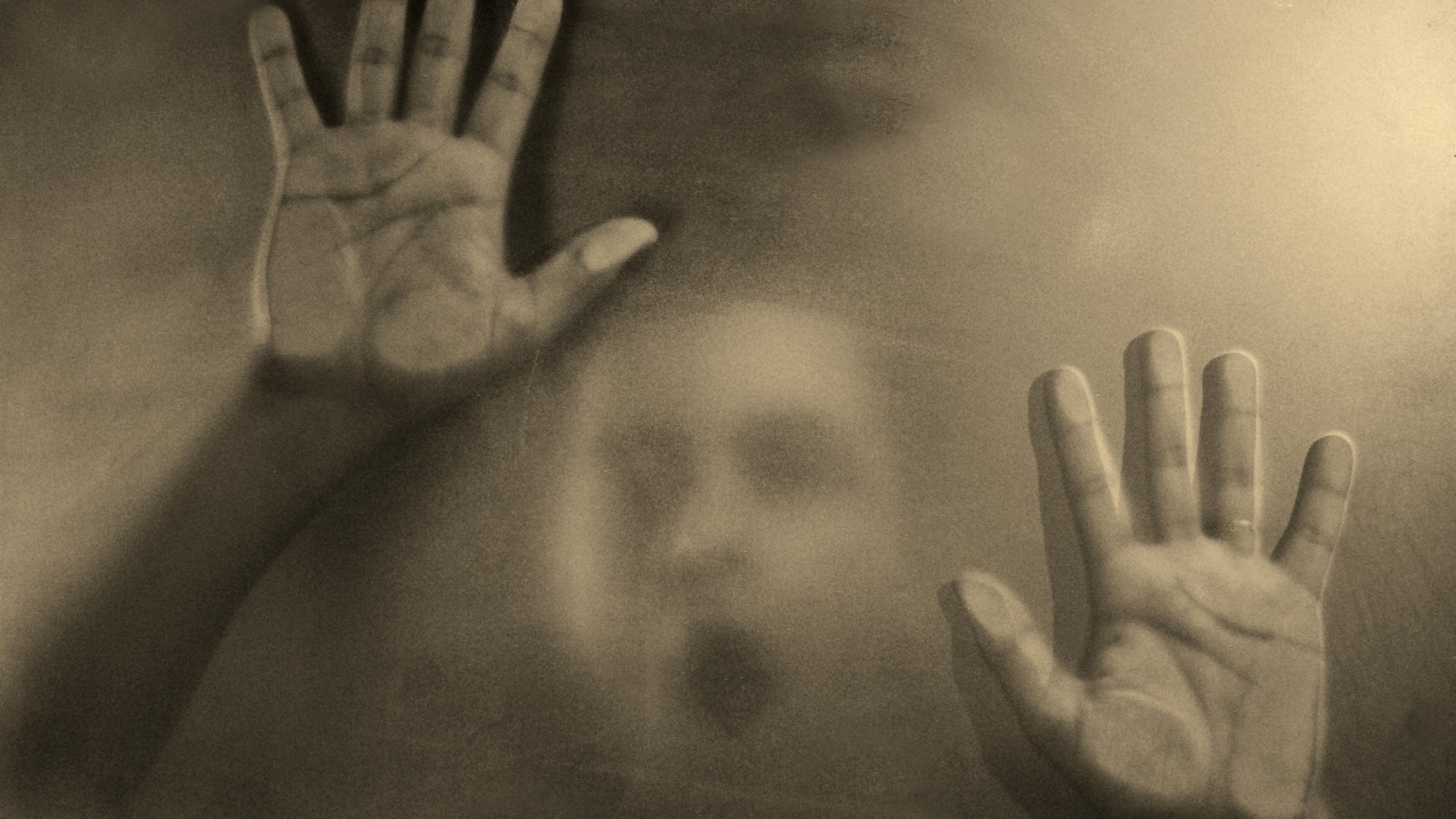 Person trapped behind frosted glass HD Wallpaper