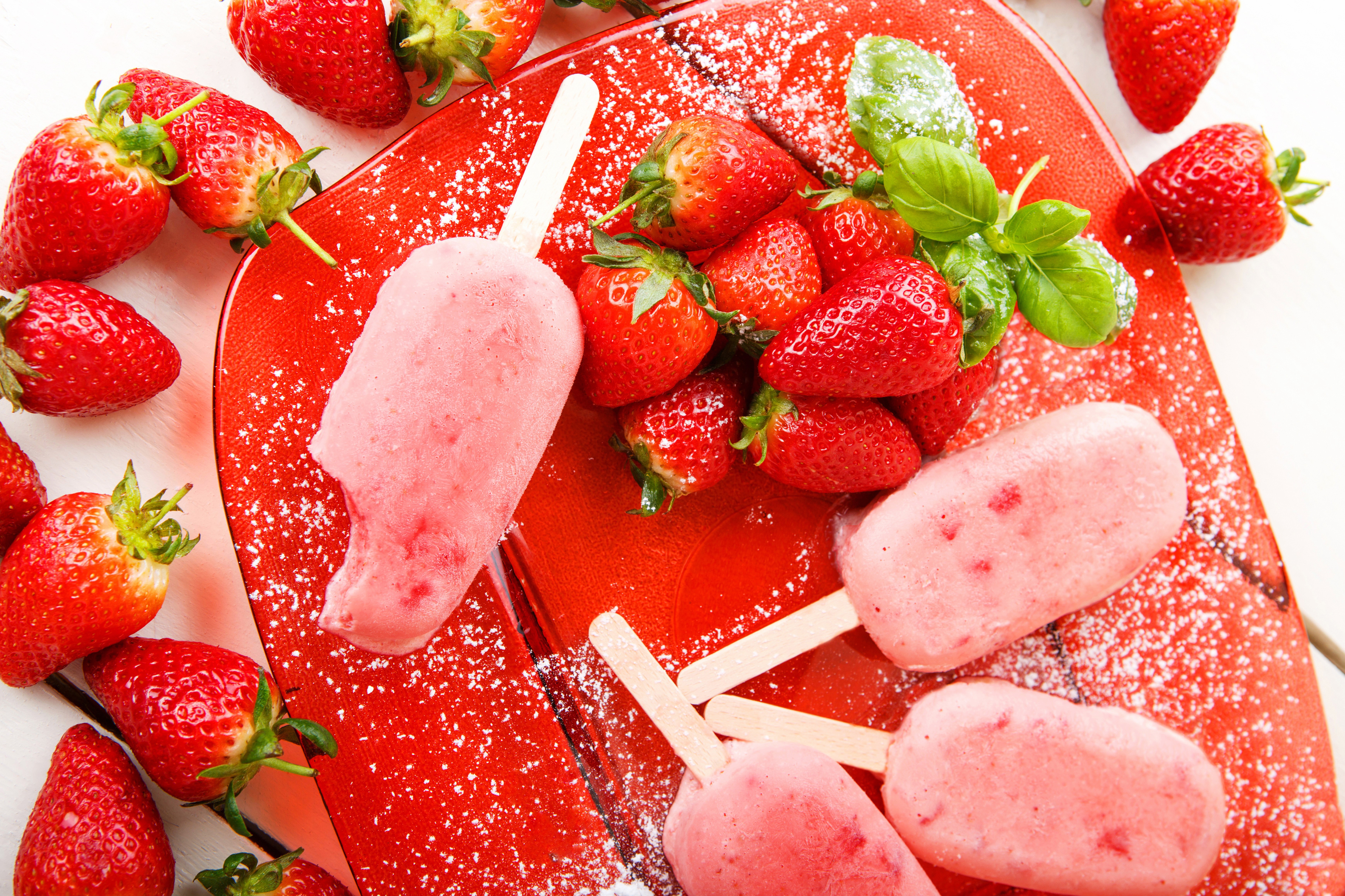 Strawberry ice cream popsicles on a red plate HD Wallpaper