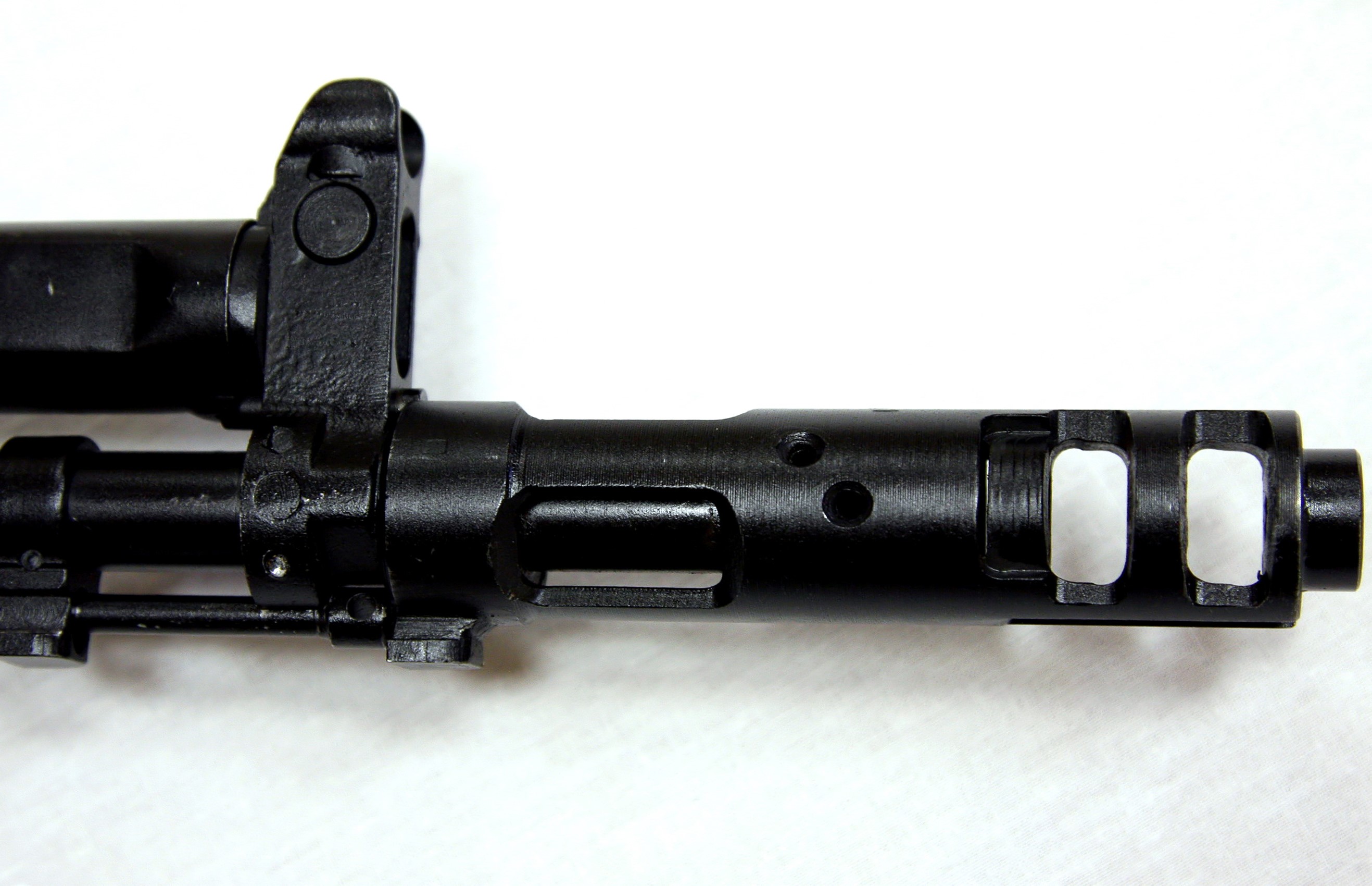 Close-up of an assault rifle muzzle brake HD Wallpaper