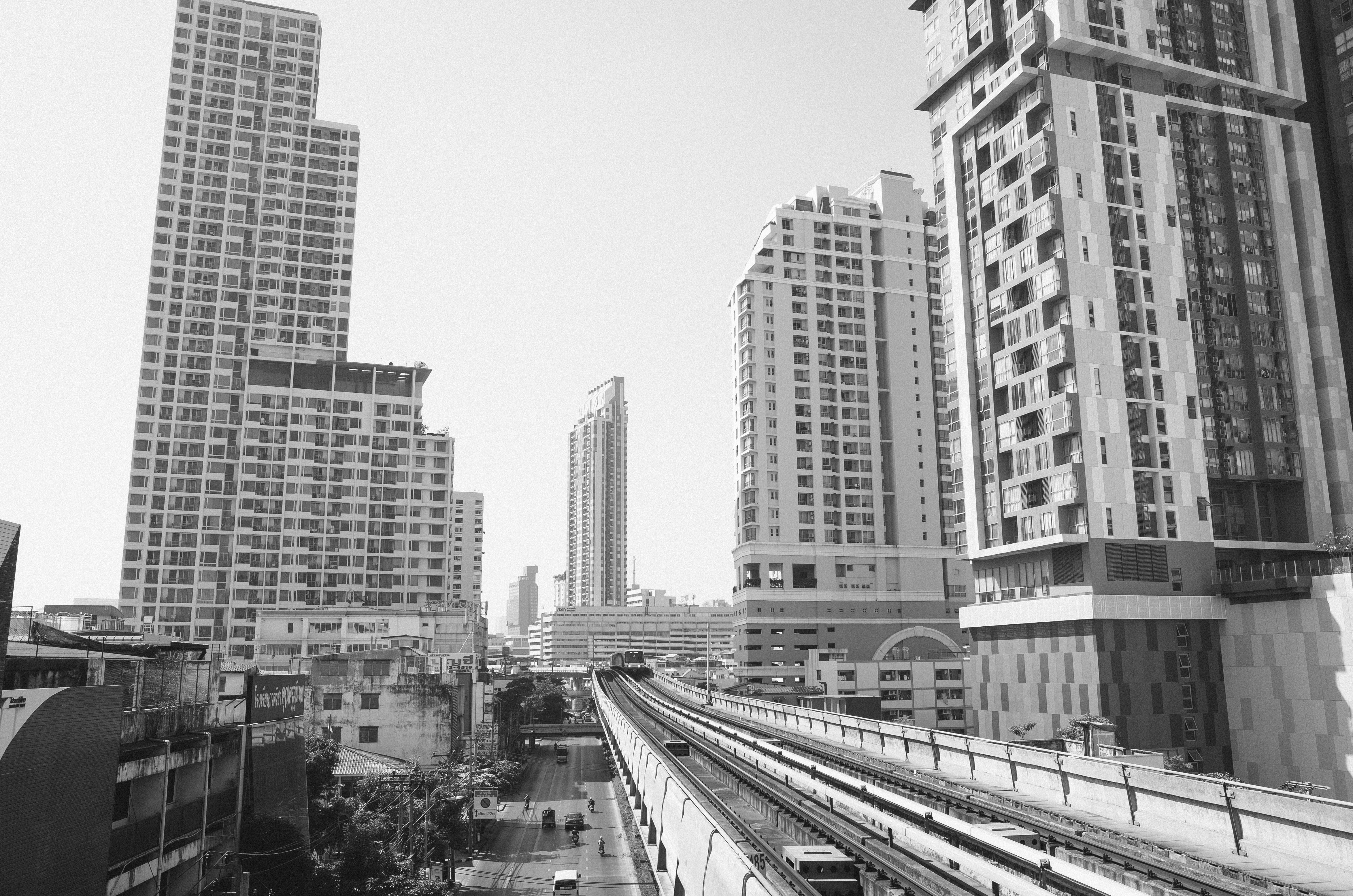 Bangkok cityscape with elevated train tracks and skyscrapers HD Wallpaper