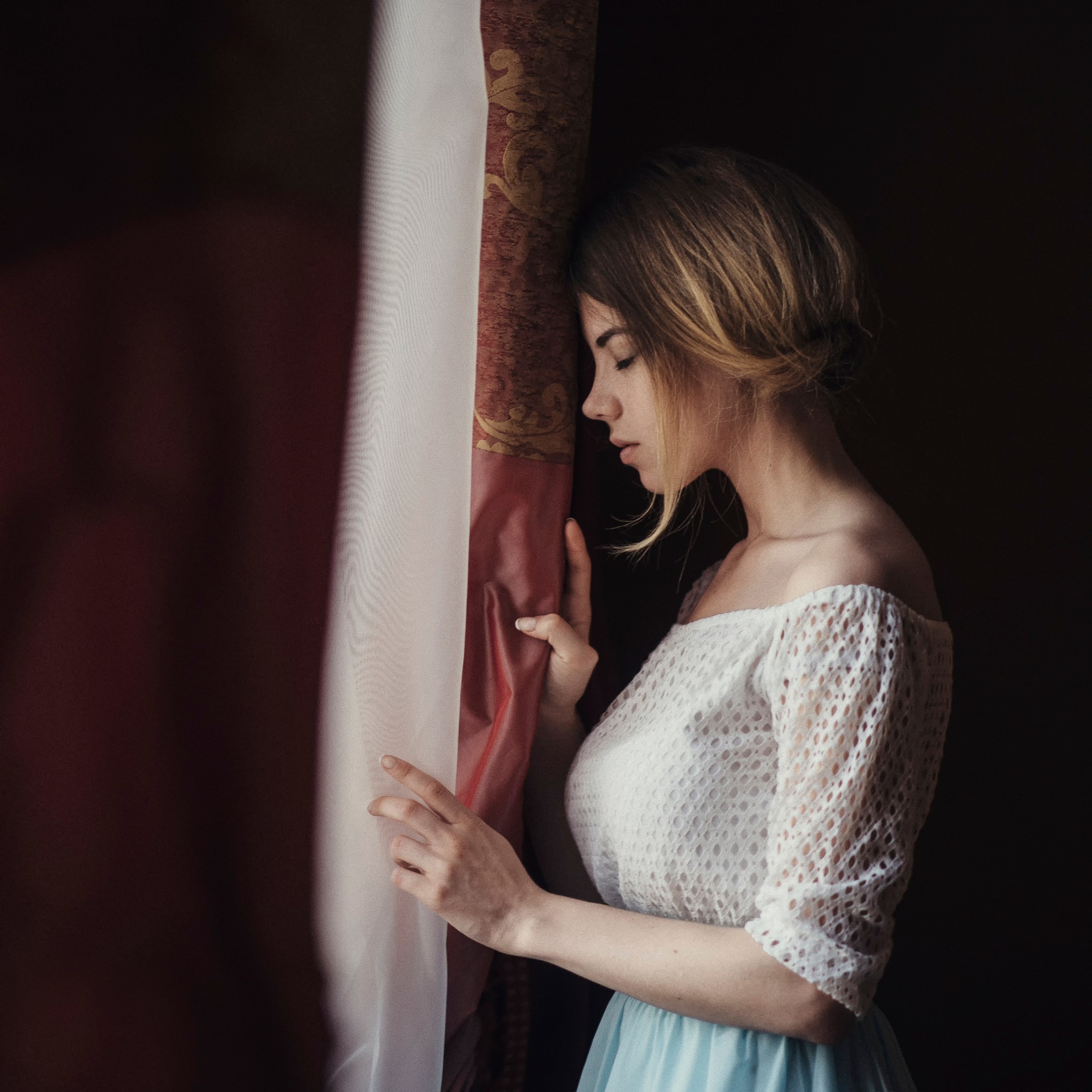 Woman leaning on a curtain HD Wallpaper
