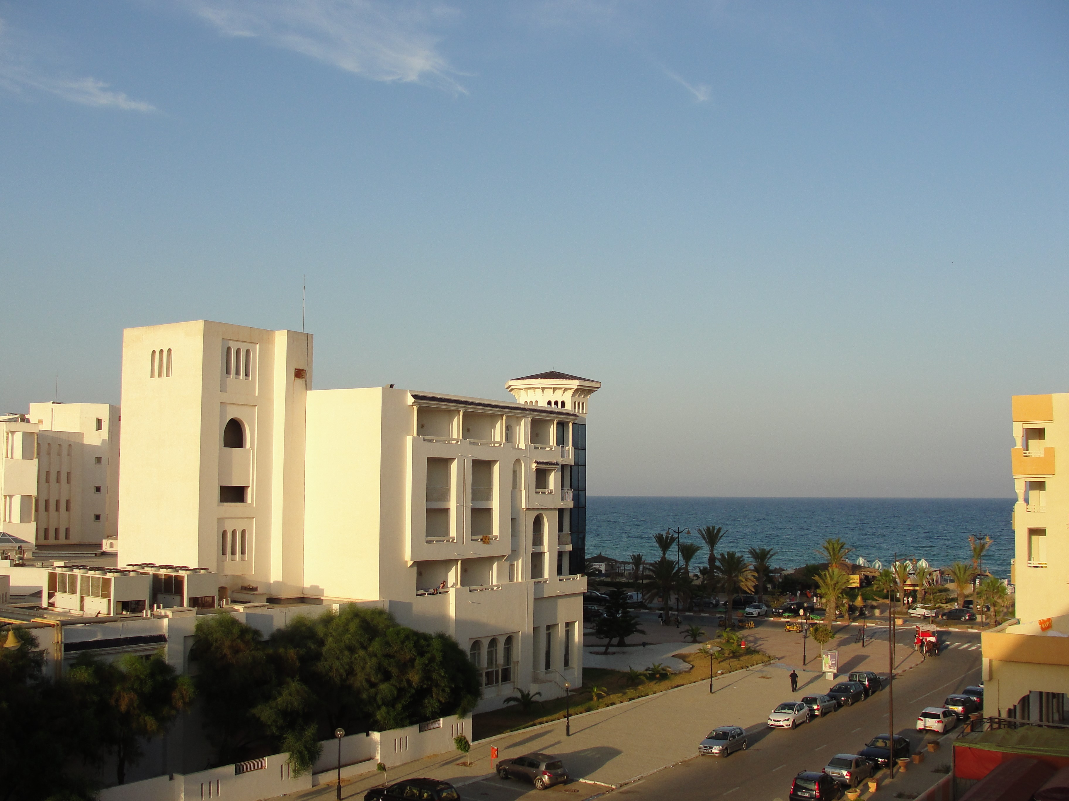Street view of Hammamet, Tunisia with hotels and the sea HD Wallpaper