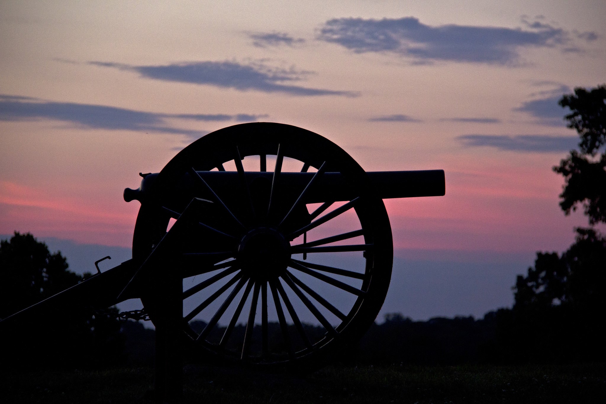 Silhouette of a cannon at sunset HD Wallpaper