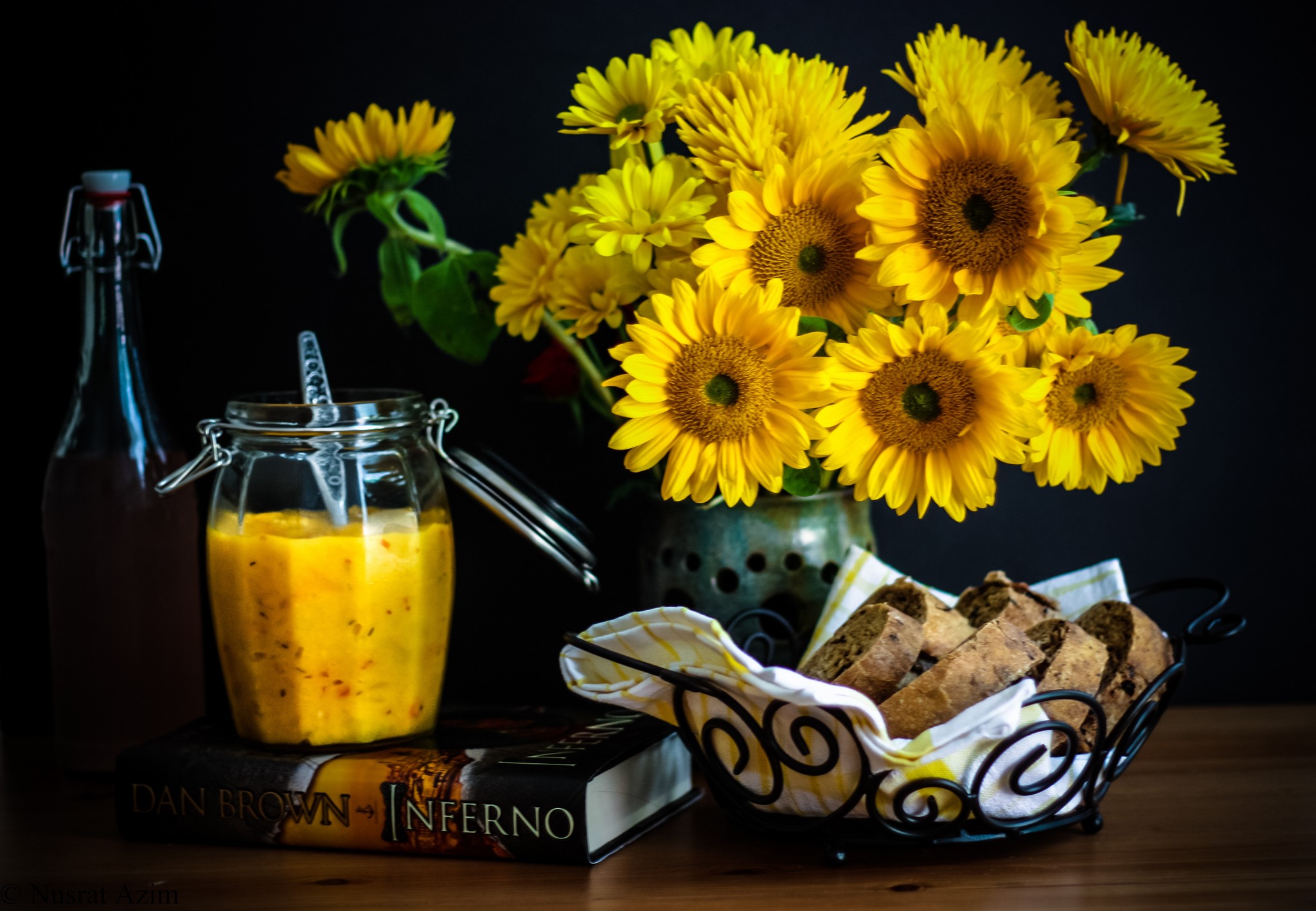 Still life with sunflowers, bread, and a book HD Wallpaper