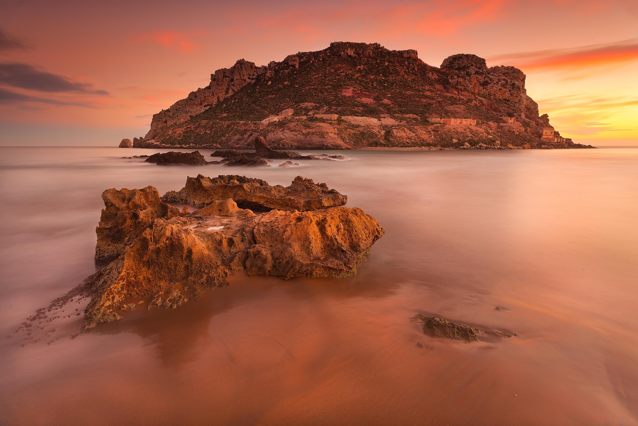 Rocky island and sea at sunset in Spain HD Wallpaper