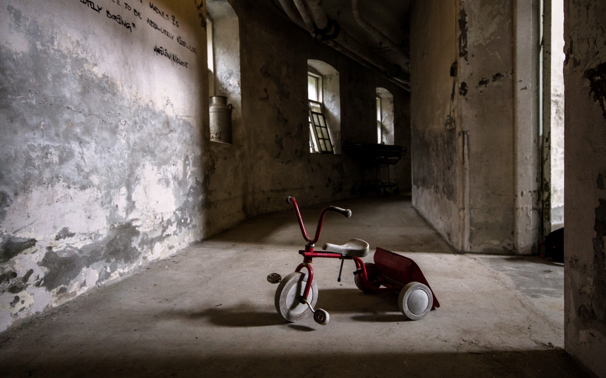 Abandoned hallway with a red tricycle HD Wallpaper